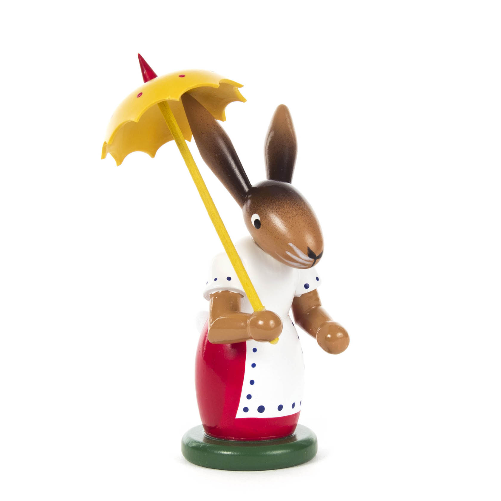 Holzfigur einer Hasendame in rotem Rock und weißer, gepunkteter Bluse mit gelbem Regenschirm. im Dregeno Online Shop günstig kaufen