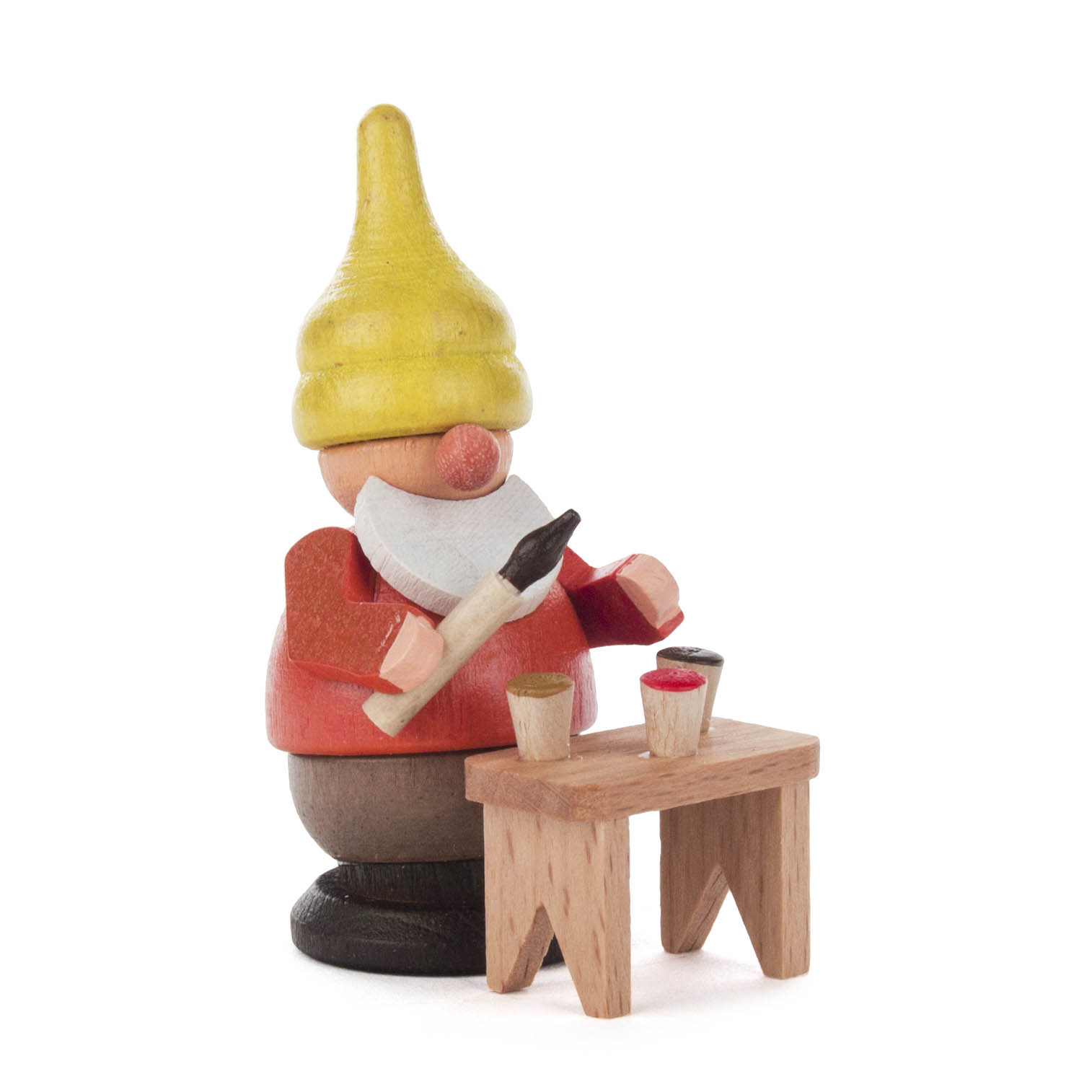 Ein hölzerner Zwerg mit gelber Mütze hält einen Pinsel und steht vor einem Tisch mit zwei Farbgefäßen. im Dregeno Online Shop günstig kaufen