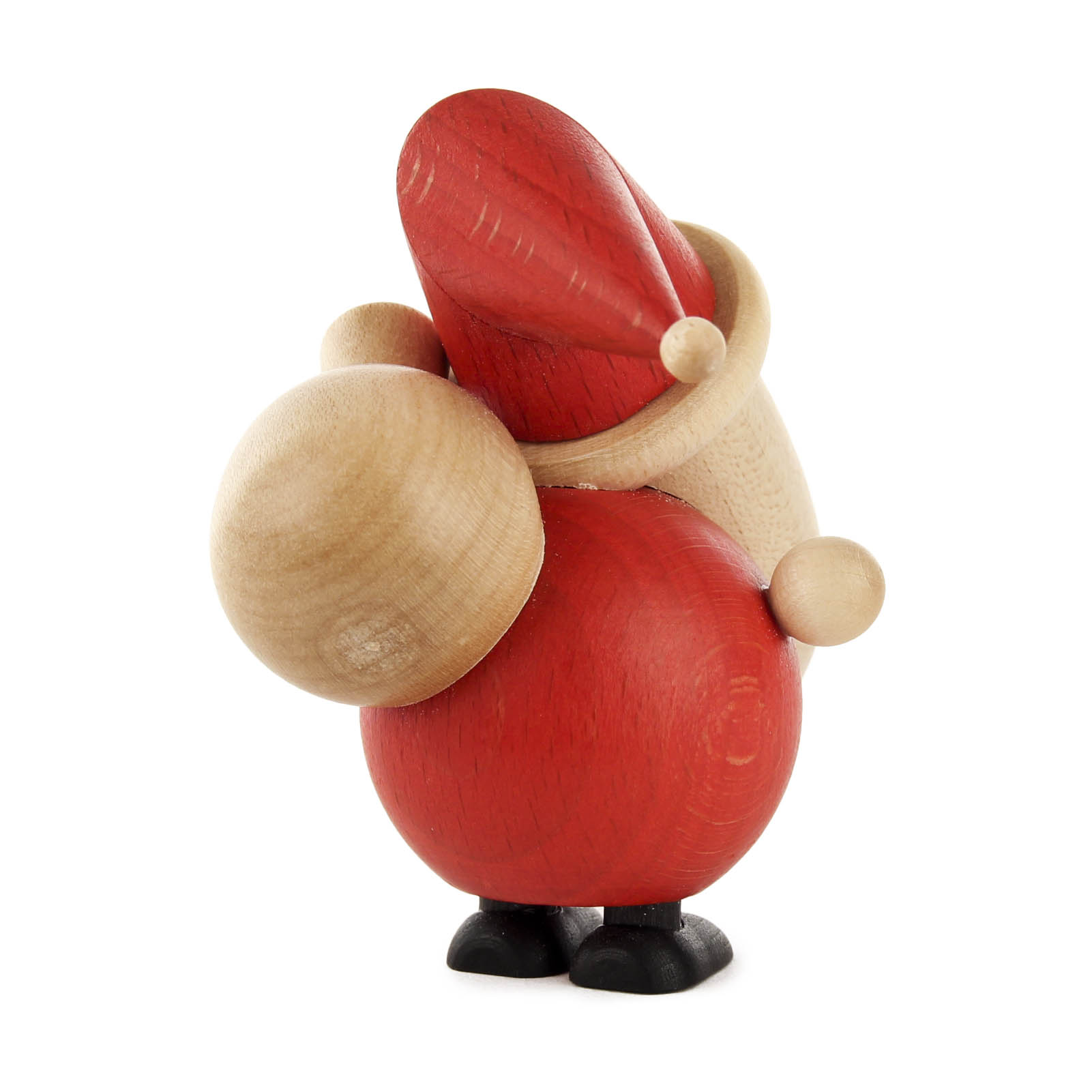 Holzfigur eines stehenden Weihnachtsmanns mit rotem Mantel und Mütze, der einen großen Sack auf der Schulter trägt.