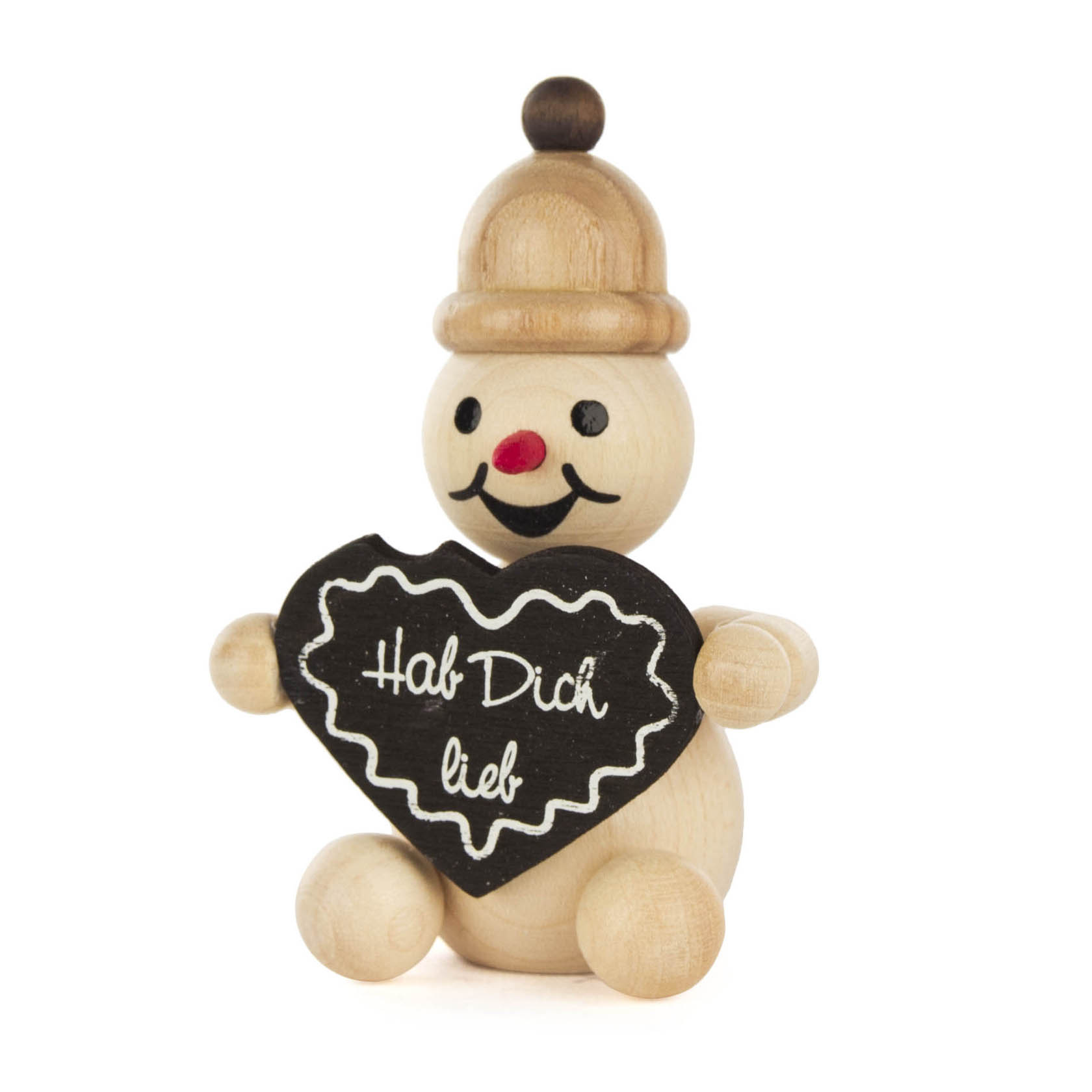 Holzschneemann mit rotem Hut, hält ein schwarzes Lebkuchenherz mit der Aufschrift 'Hab Dich lieb' in den Händen. im Dregeno Online Shop günstig kaufen
