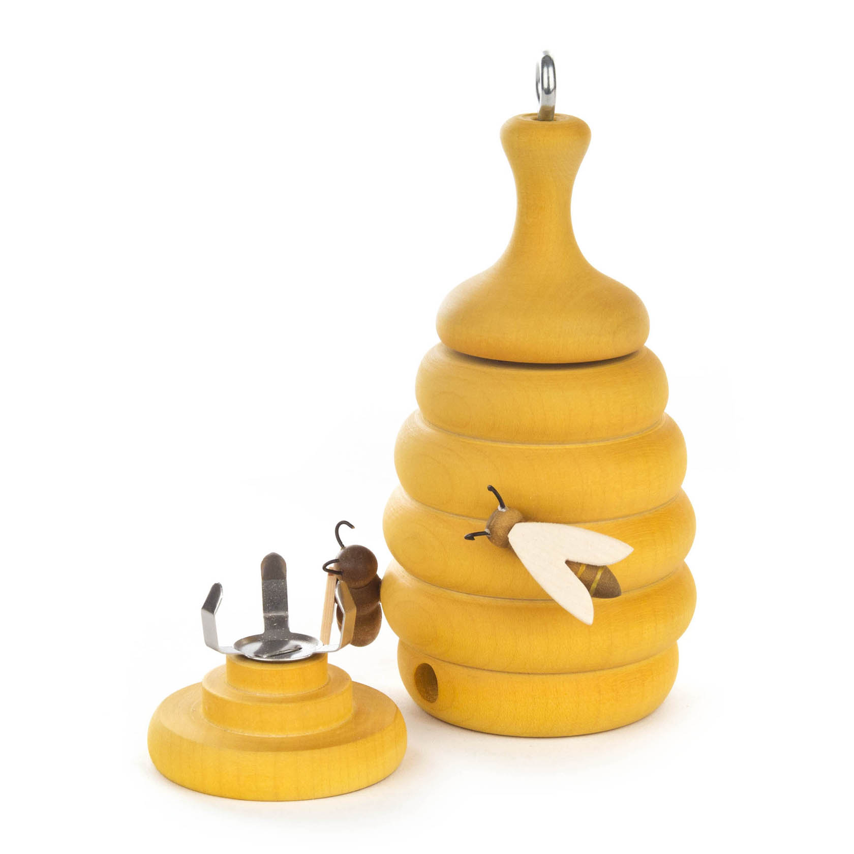Holz-Bienenstock-Räucherfigur mit abnehmbarem Deckel und Haken zum Aufhängen, verziert mit stilisierten Bienenfiguren.