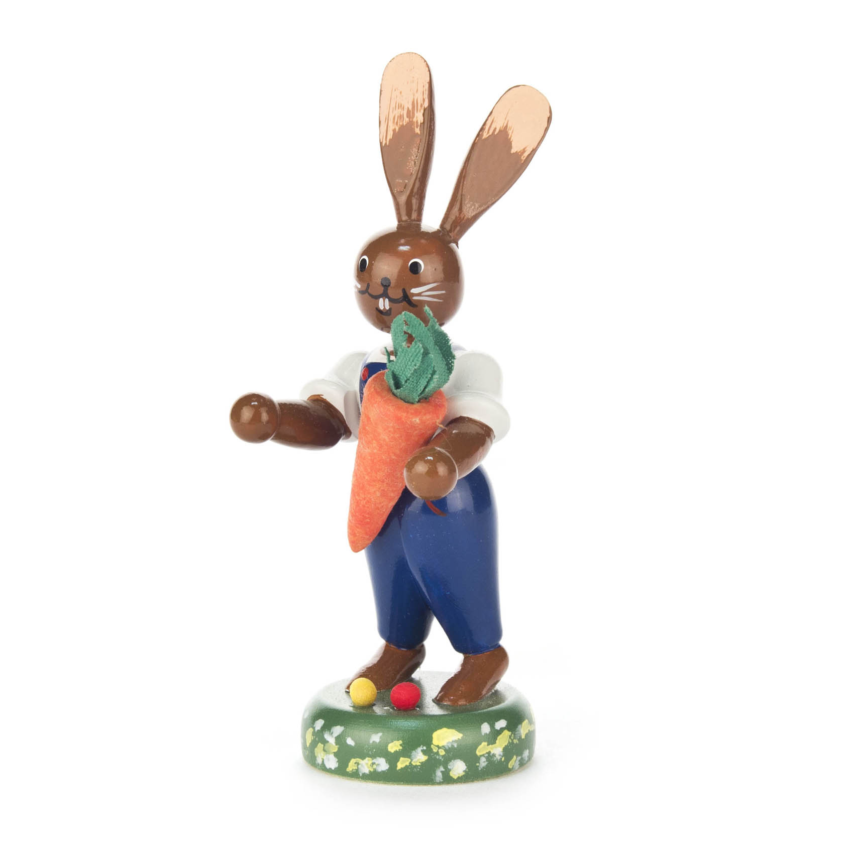 Kleine Figur eines Hasen in blauer Hose und weißem Hemd, der eine große Möhre in den Armen hält. im Dregeno Online Shop günstig kaufen