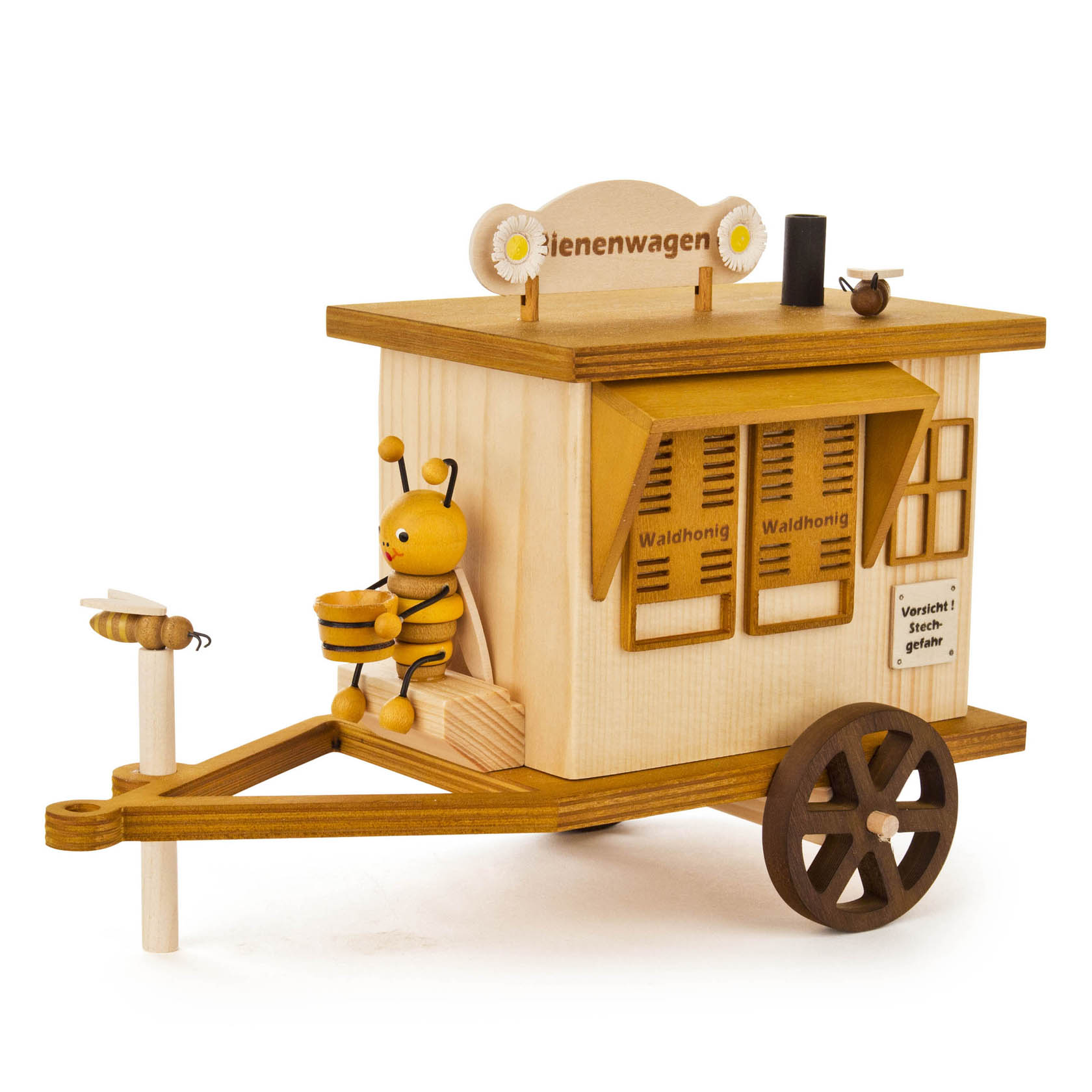 Holzmodell eines Bienenwagens mit einer kleinen Bienenfigur, die einen Eimer hält. Das Modell hat Fensterklappen mit 'Waldhonig' und einen Schornstein. im Dregeno Online Shop günstig kaufen