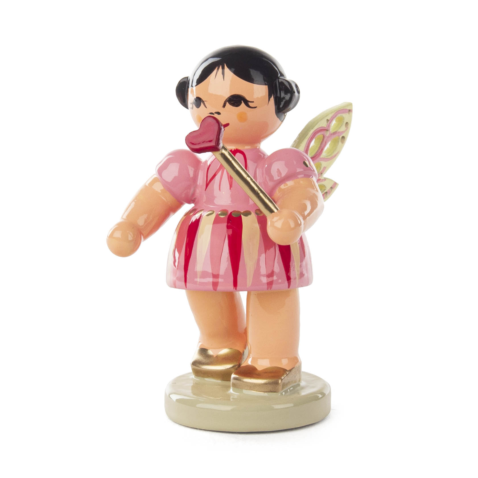 Eine Figur einer Fee namens Rubinia Herzenszauber. Sie trägt ein pinkes Kleid mit roten Streifen und hält einen Herz-Zauberstab.