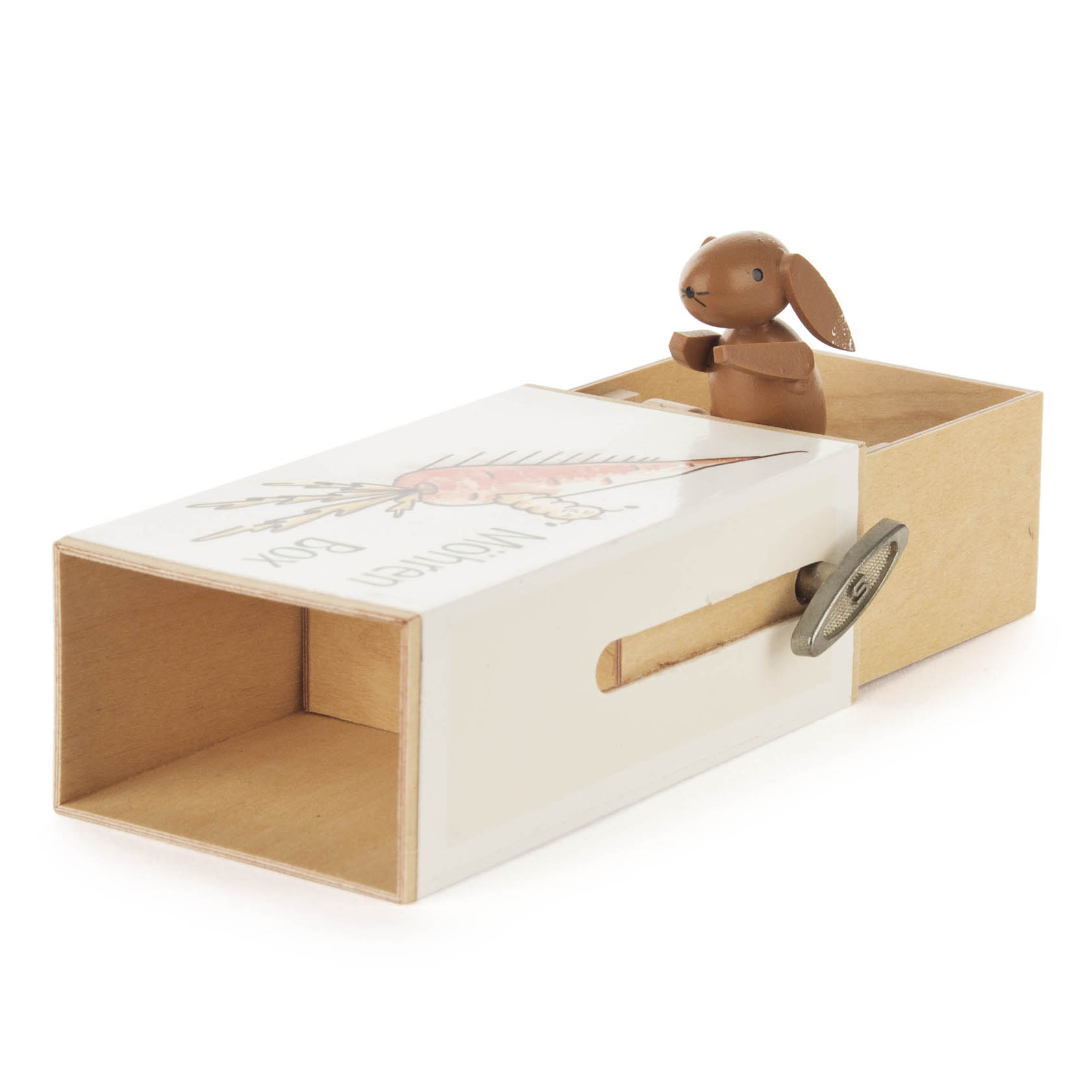Eine Schiebebox aus Holz mit der Aufschrift 'Möhren-Box'. Ein kleiner Holz-Hase sitzt oben auf der Box. Ein seitlicher Schlüssel spielt die Melodie 'Humpty Dumpty'.