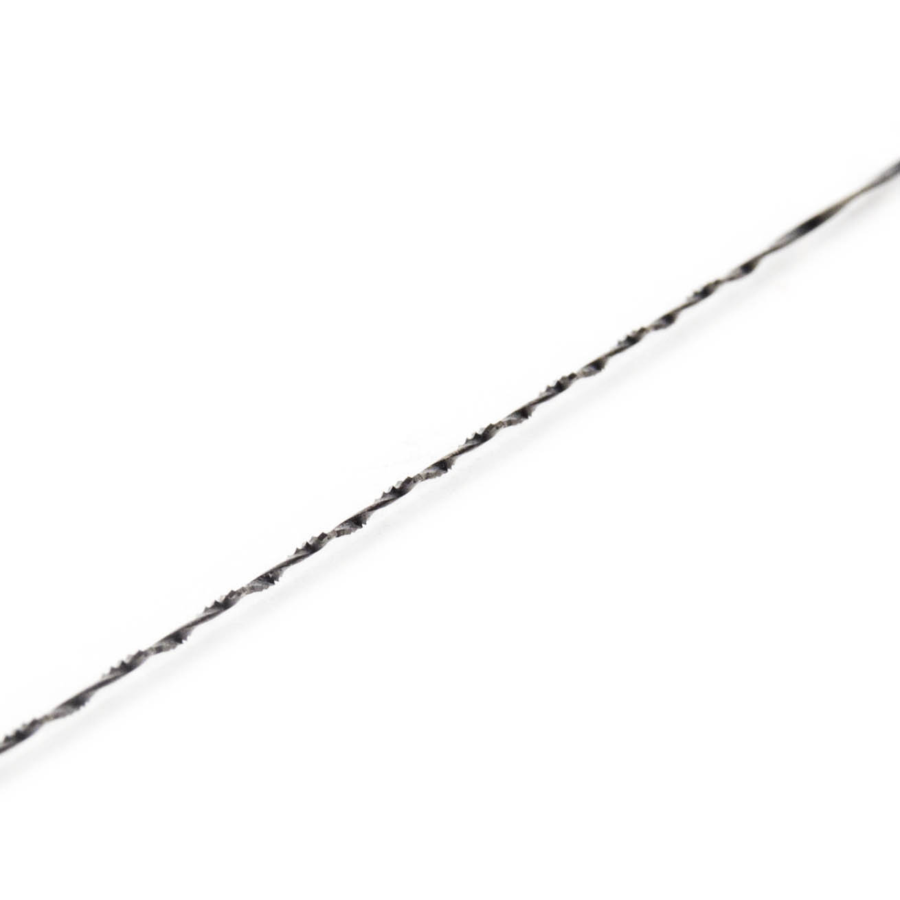 Close-up image of a size 3 spiral fretsaw blade, designed for cutting wood, showcasing its twisted form and sharp edges.