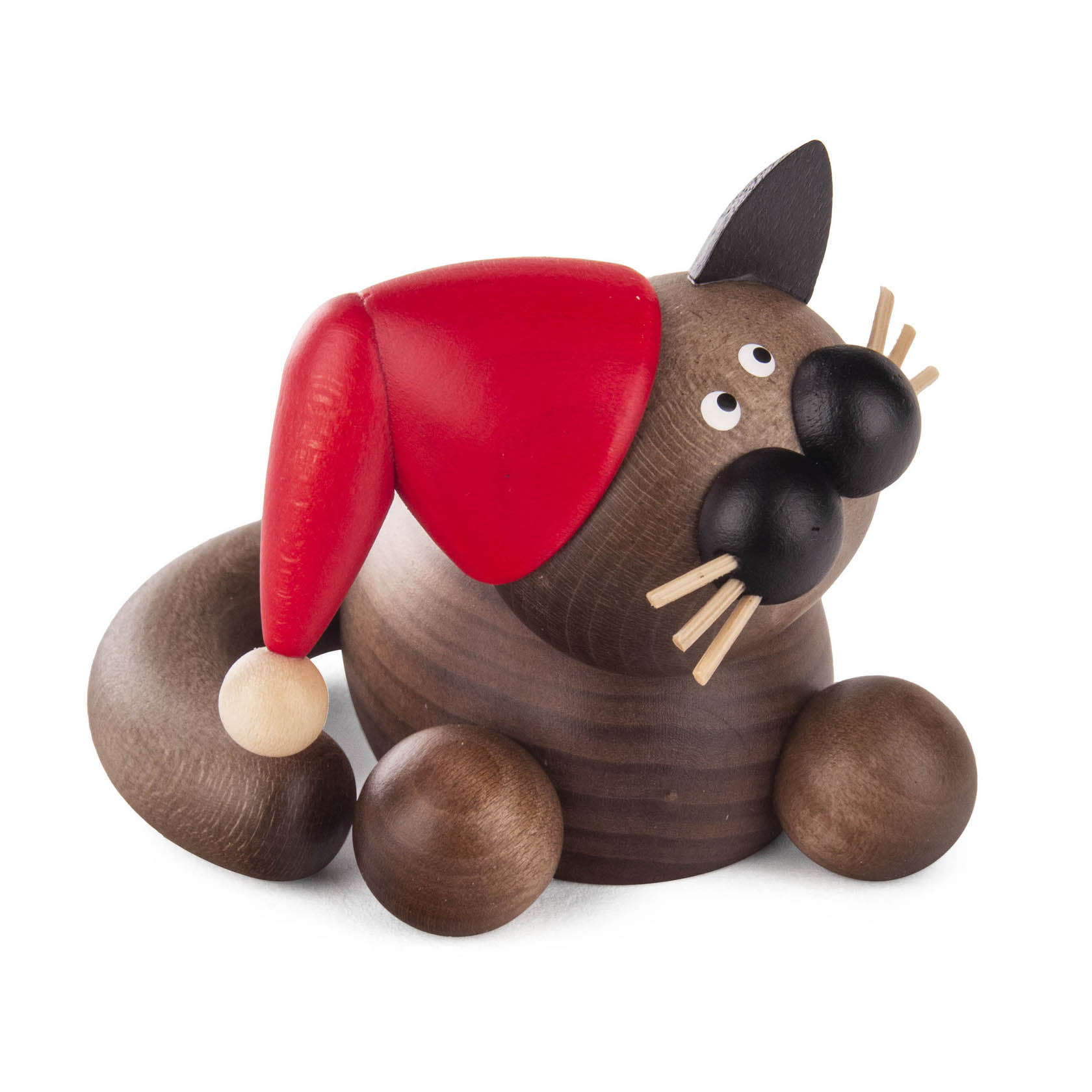 Gray-black cat toy named Karli, cuddling while wearing a red Christmas hat.
