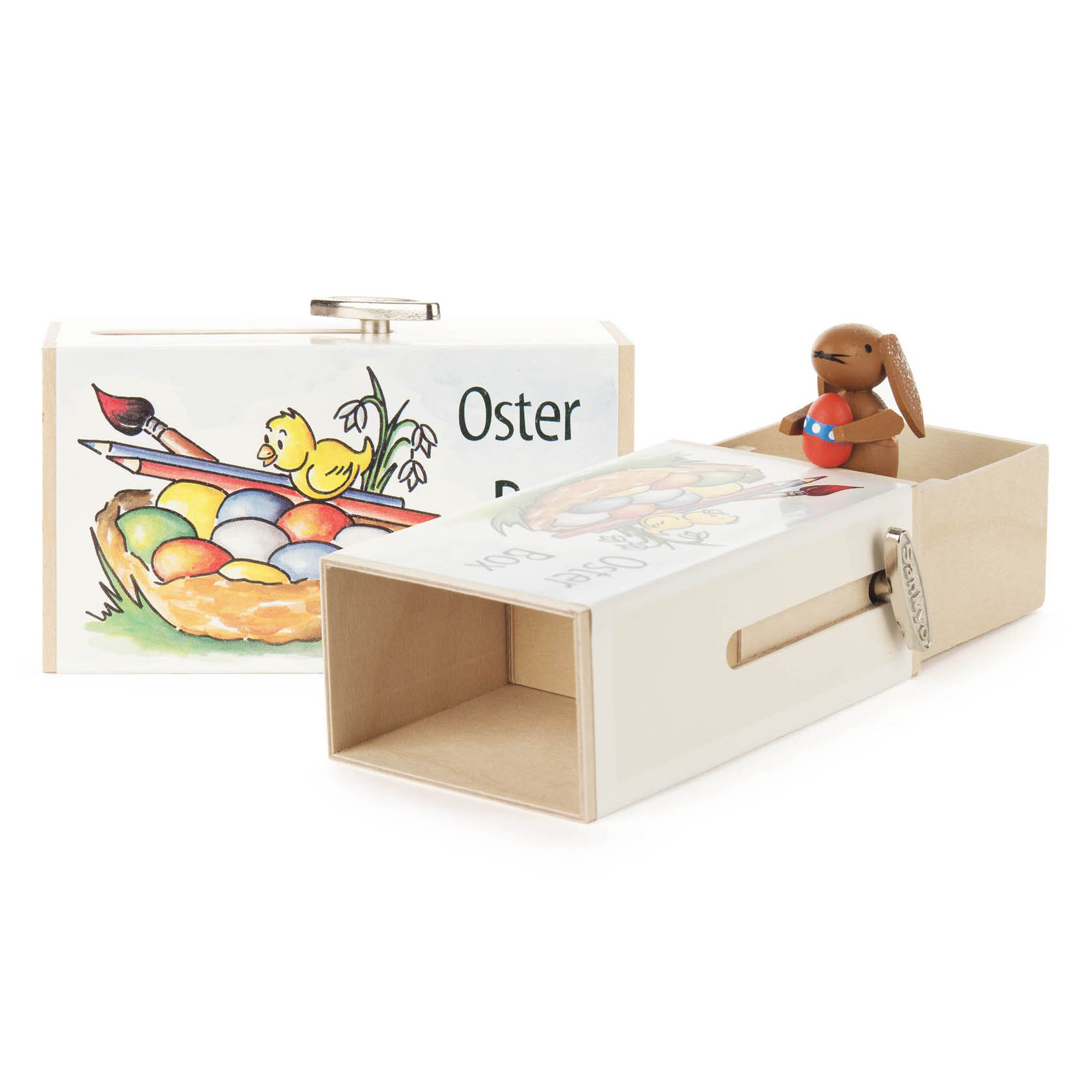 Schiebebox mit der Aufschrift 'Oster-Box'. Aus der offenen Box schaut ein kleiner Holz-Hase heraus. Die Box zeigt ein Bild eines Kükens und eines Osternestes. im Dregeno Online Shop günstig kaufen