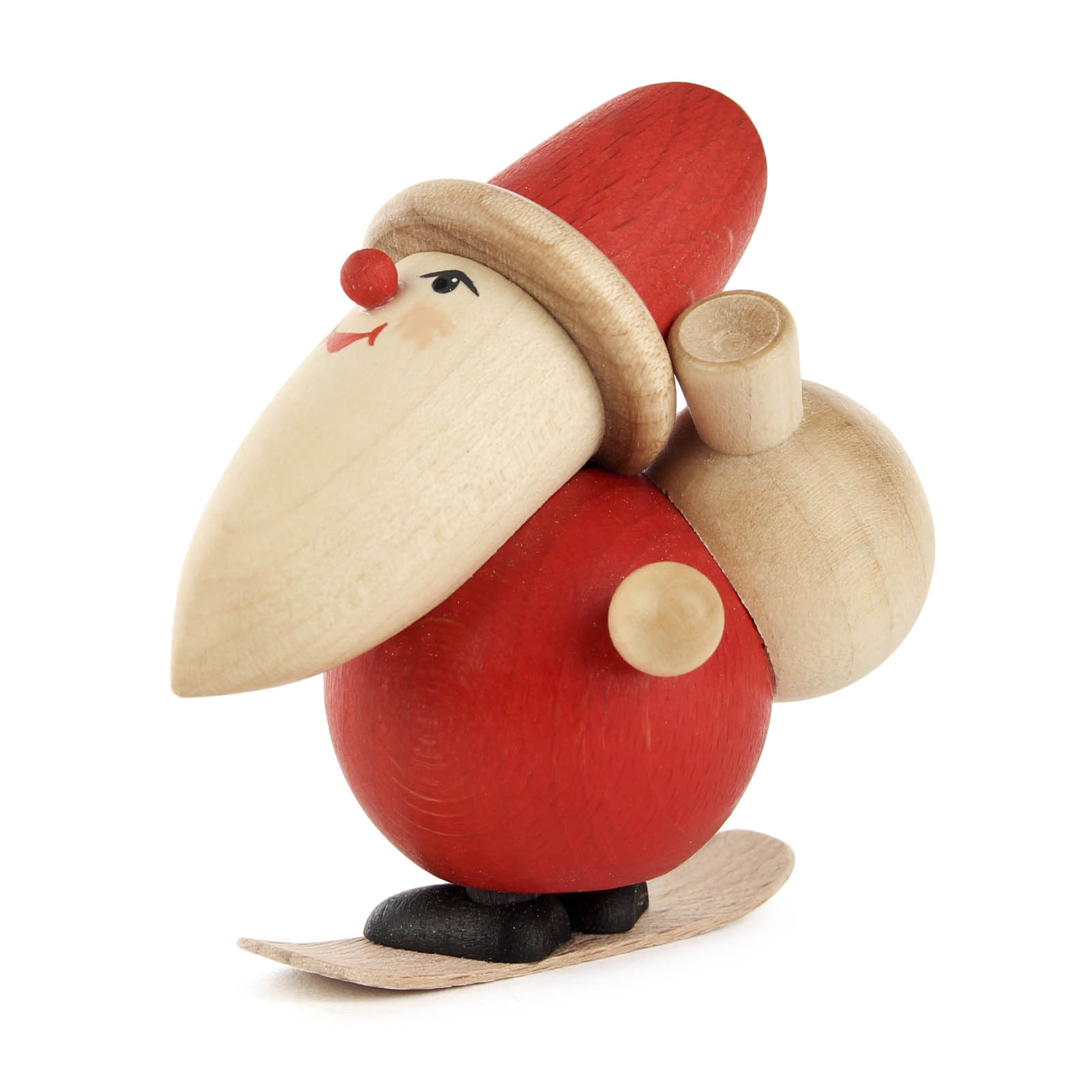 Holzfigur eines Weihnachtsmannes, der auf einem Snowboard steht, mit rotem Anzug, spitzer Mütze und einem Sack auf dem Rücken.