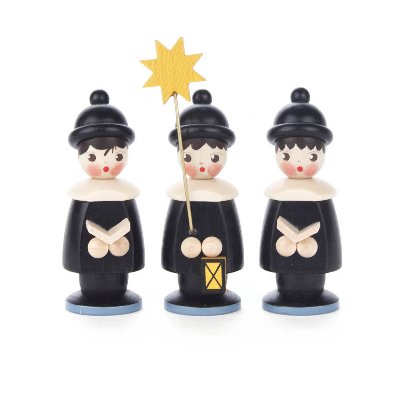 Drei schwarze Kurrendefiguren, 7,5 cm groß, mit weißen Kragen und roten Wangen. Eine Figur hält einen Sternstab und eine Laterne. im Dregeno Online Shop günstig kaufen