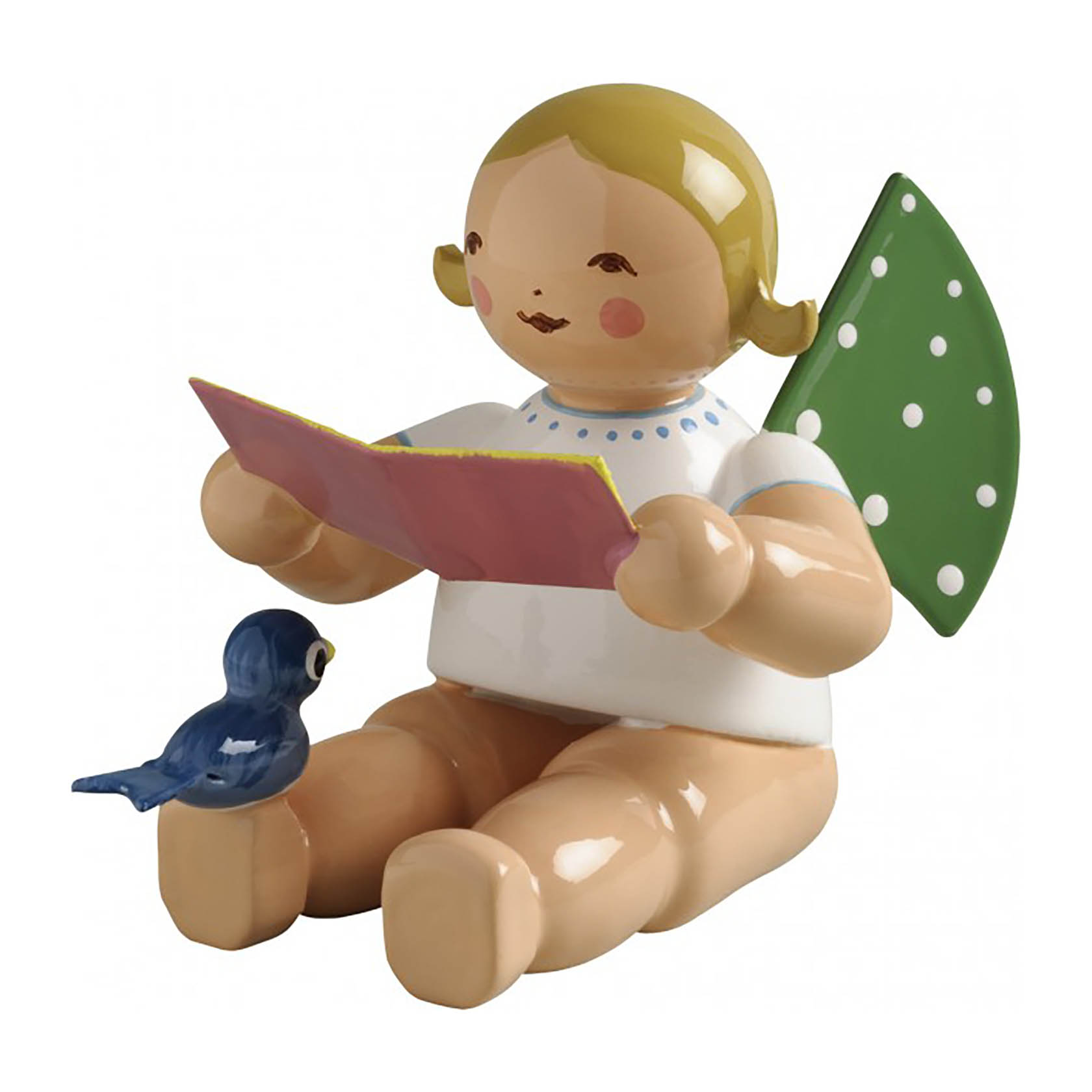 Eine Engelsfigur mit grünen, gepunkteten Flügeln sitzt und hält ein Notenblatt in den Händen. Ein blauer Vogel sitzt neben ihr. im Dregeno Online Shop günstig kaufen