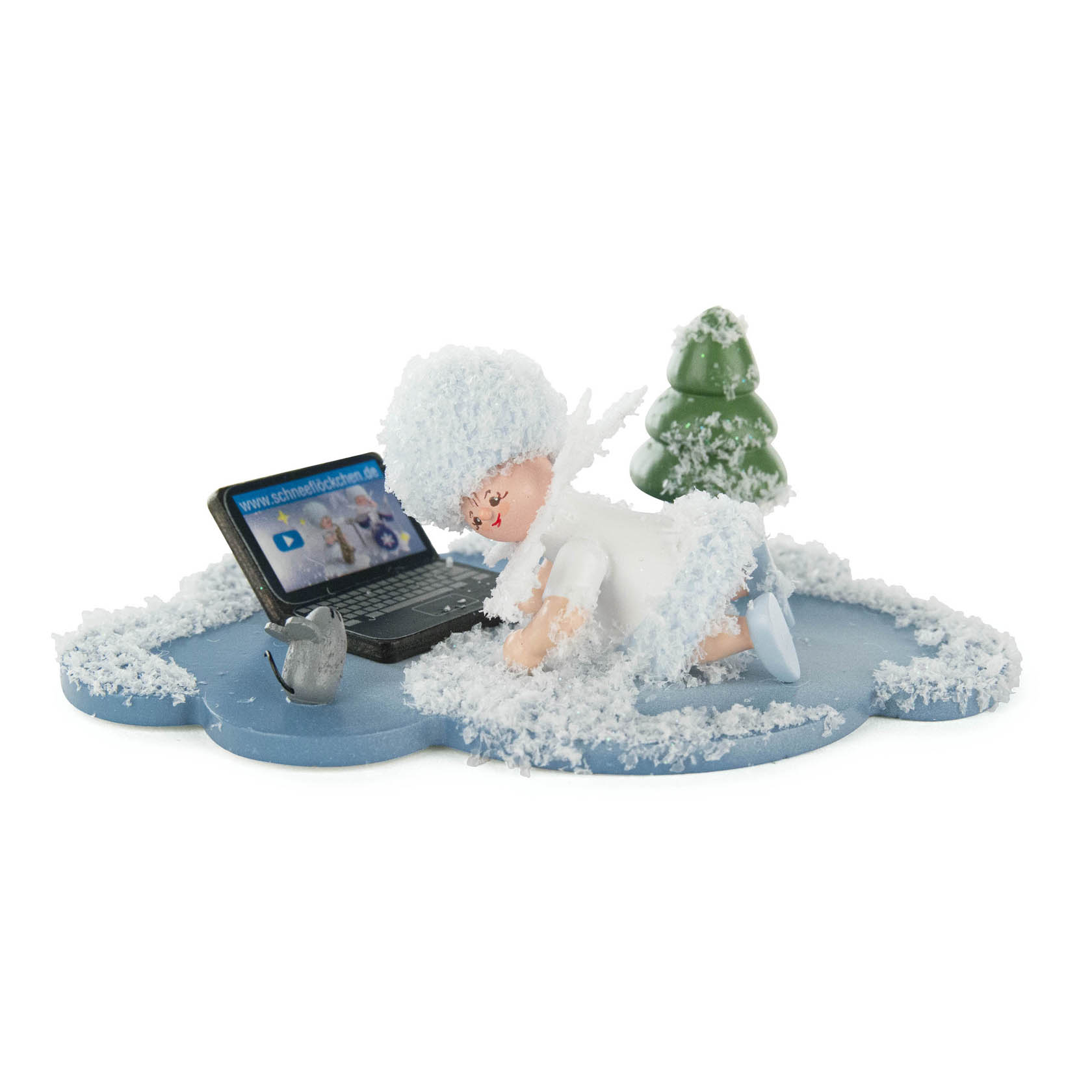 A small snow-themed figurine of a child wearing a white hat and clothes, lying on its stomach using a laptop, surrounded by snow. im Dregeno Online Shop günstig kaufen