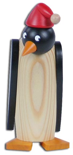 Holzfigur eines Pinguins mit schwarzen Flügeln, orangenem Schnabel und Füßen, trägt eine rote Mütze mit Bommel. im Dregeno Online Shop günstig kaufen