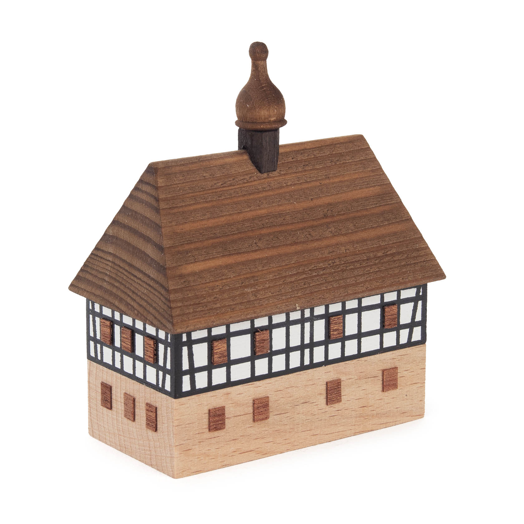 Miniatur eines zweistöckigen Fachwerkhauses mit braunem Dach und Schornstein, das eine Dorfschule darstellt.