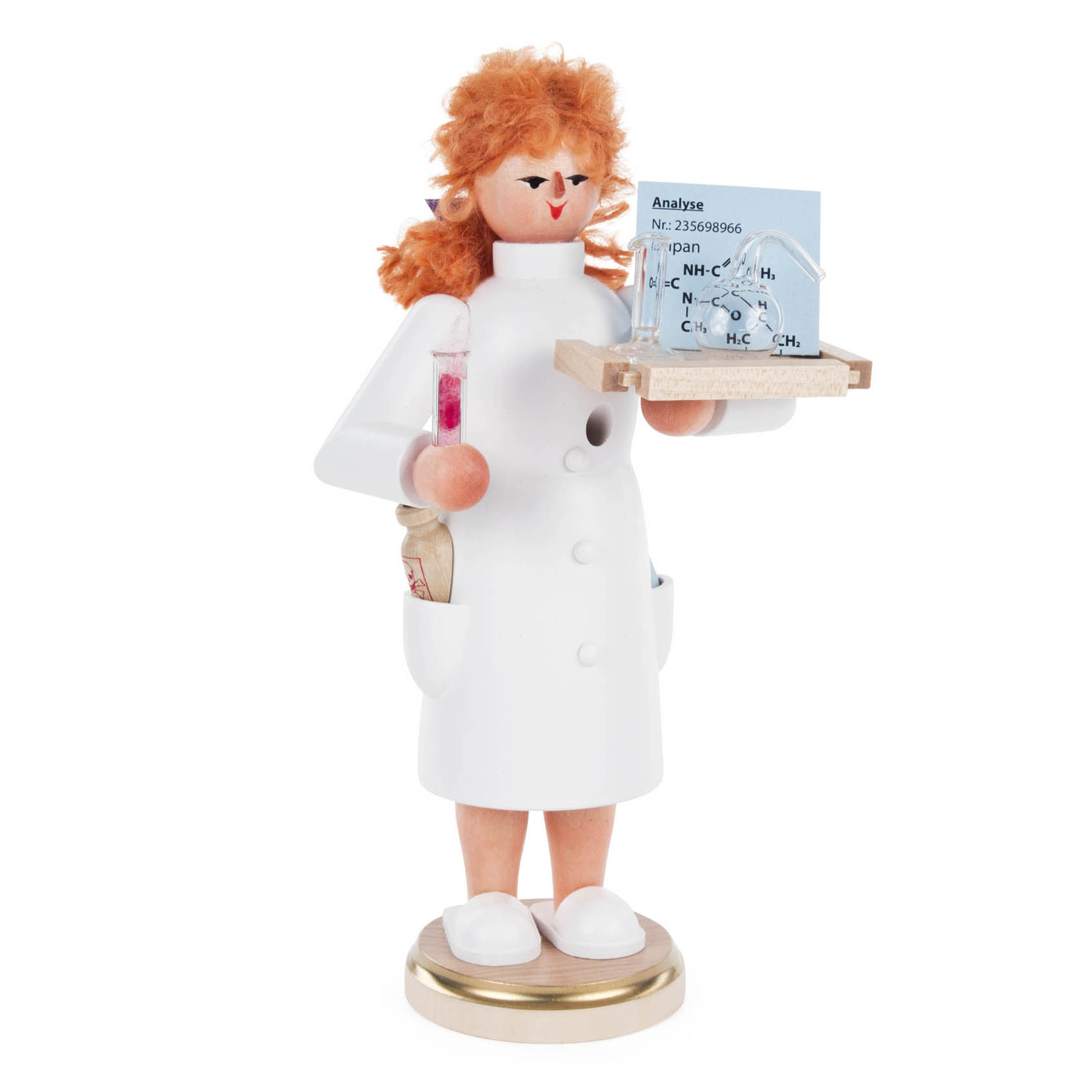 A wooden smoking figure of a female chemist with a white lab coat, holding glass test tubes. She has curly orange hair and stands on a circular base. im Dregeno Online Shop günstig kaufen