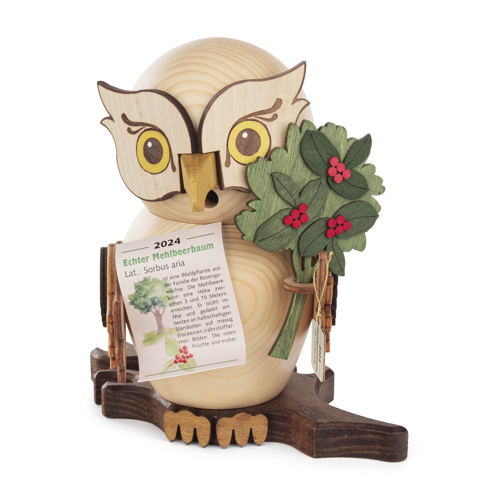 Holzeule aus Naturholz mit gelben Augen und kleinem Schnabel, hält Zweig mit roten Beeren und grünem Laub. Bezeichnung: Echt Mehlbeerbaum 2024. im Dregeno Online Shop günstig kaufen