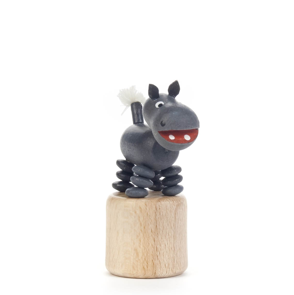 Holz-Wackeltier in Form eines fröhlichen Flusspferds mit einer Spiralfeder als Bein. Das Flusspferd hat große Augen, einen breiten Mund und steht auf einem runden Sockel. im Dregeno Online Shop günstig kaufen