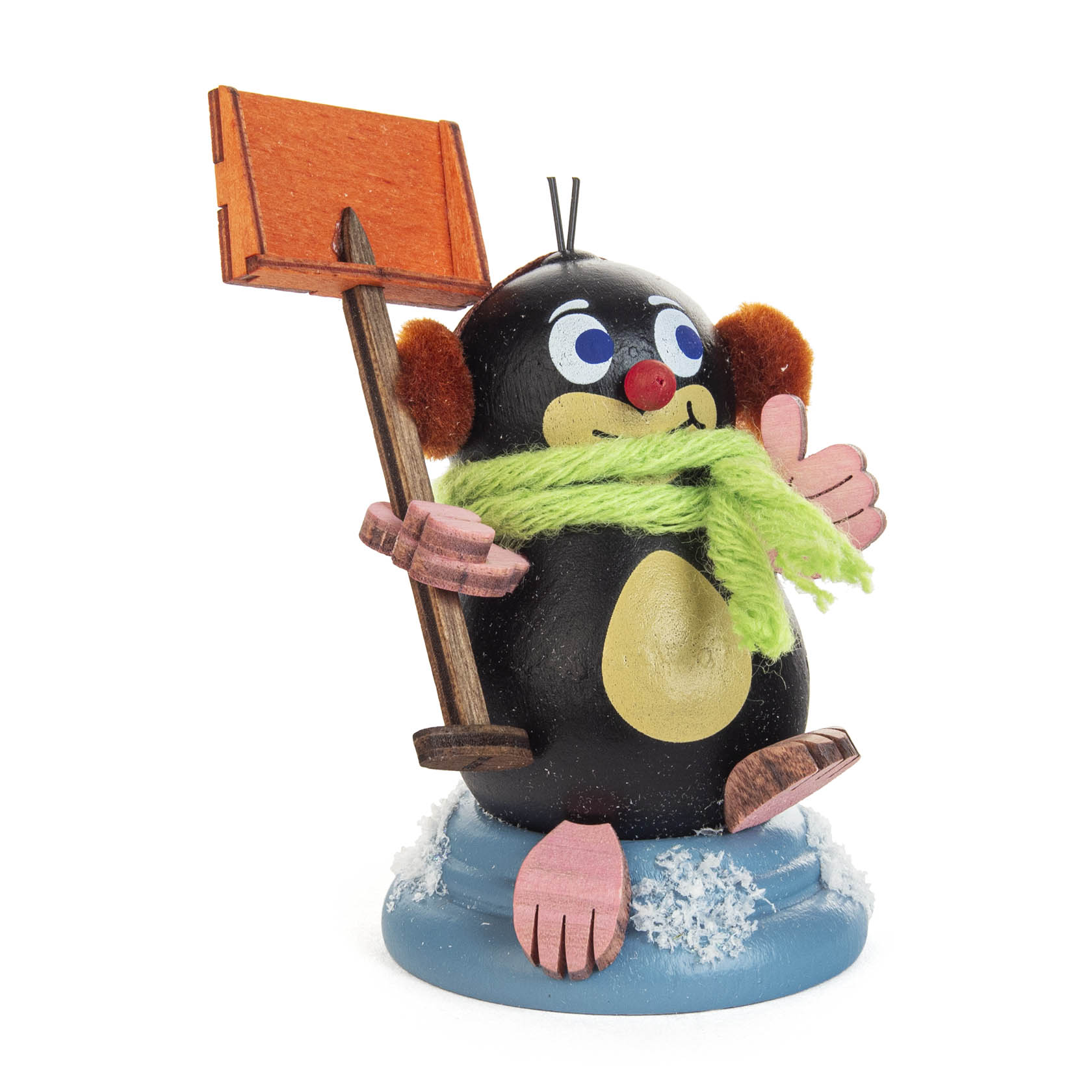 A small figurine of a smiling mole named 'Egon' with a green scarf, holding an orange shovel, sitting on a snow-covered base. im Dregeno Online Shop günstig kaufen