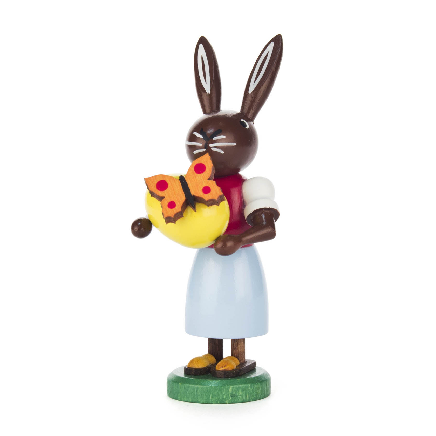 Holzfigur einer schwarzen Häsin mit roten Kleid, die ein gelbes Ei hält. Ein Schmetterling sitzt auf dem Ei. im Dregeno Online Shop günstig kaufen