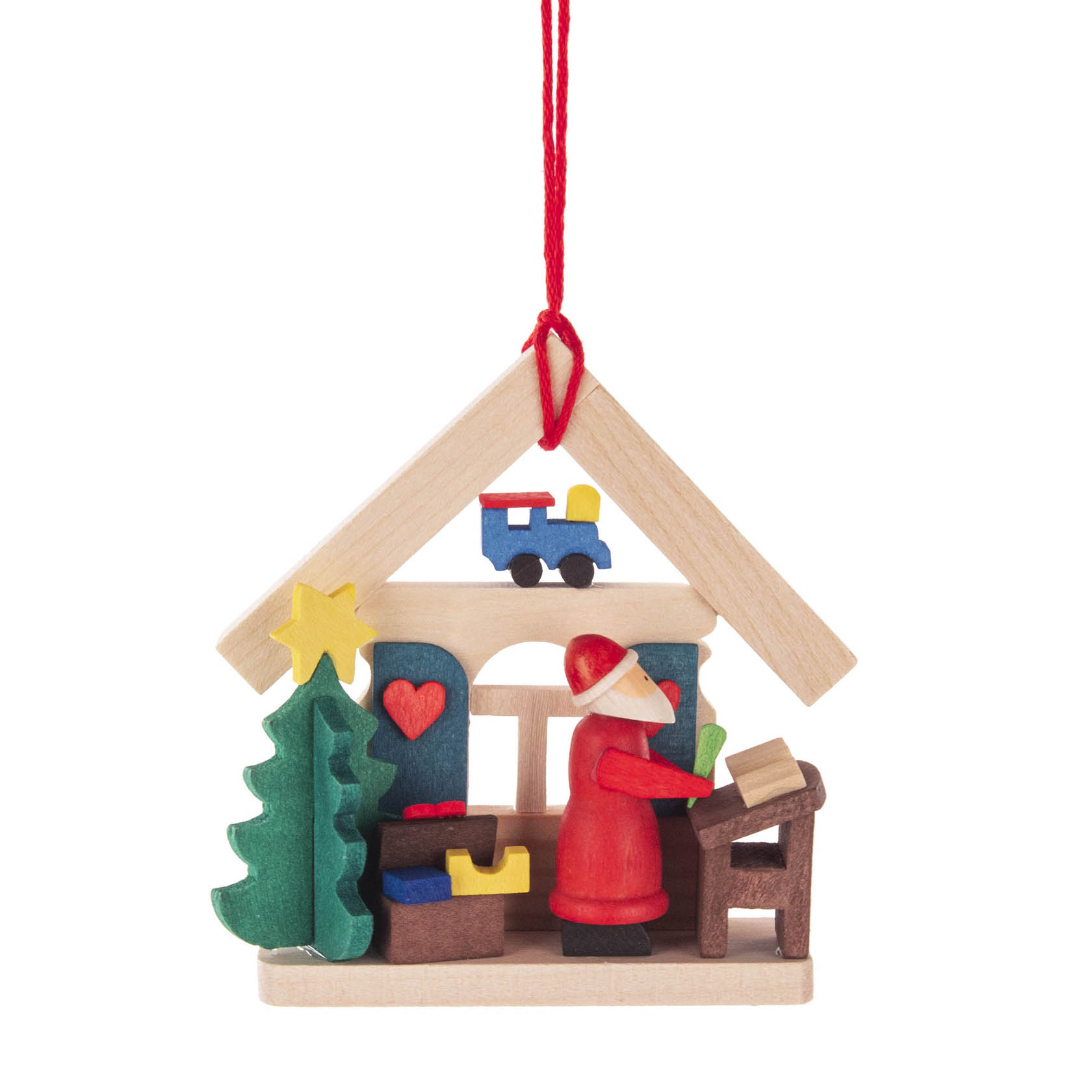 Holzanhänger in Form eines Hauses, darin steht ein Weihnachtsmann am Pult mit Wunschzettel. Neben ihm ein großer Weihnachtsbaum, im Hintergrund Spielzeug. im Dregeno Online Shop günstig kaufen