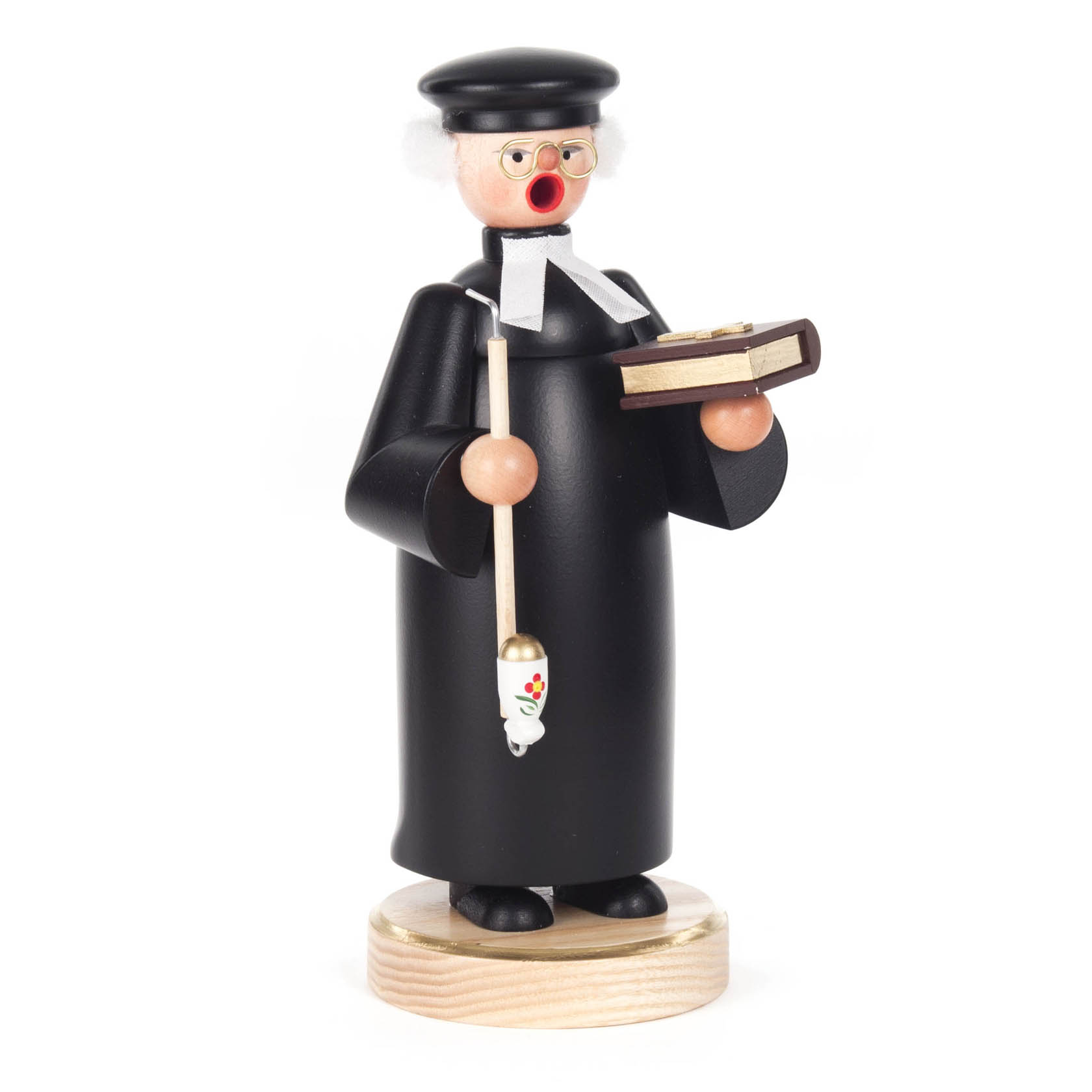Holzfigur eines Räuchermannes in Form eines Pfarrers mit schwarzem Talar, weißem Beffchen, Brille, Buch und Räucherpfeife auf einem Holzsockel. im Dregeno Online Shop günstig kaufen