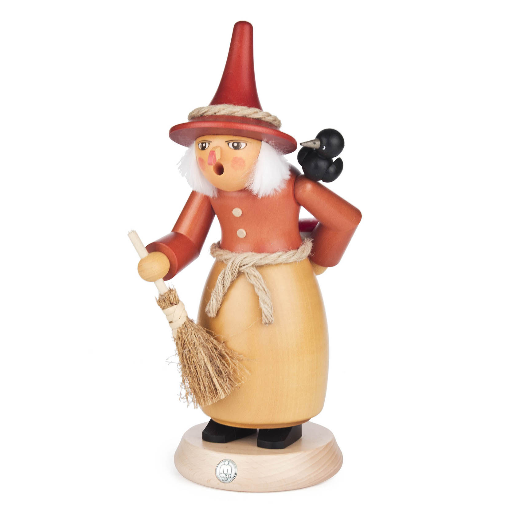 Wooden incense smoker figure of a witch with a red hat, holding a broom, wearing an orange shirt and a yellow apron, with white hair and a small black cat on her back. im Dregeno Online Shop günstig kaufen