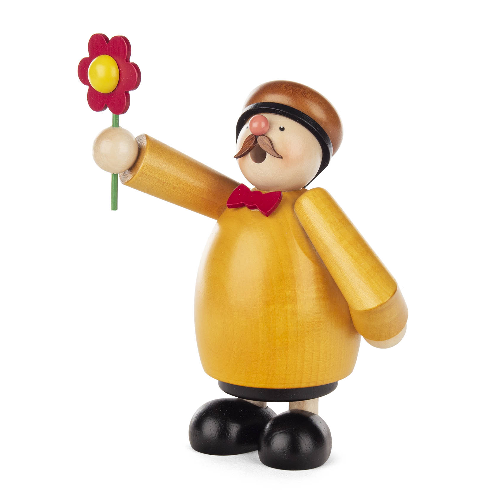 A wooden incense smoker figure, known as Räuchermann, dressed in yellow with a red bow tie, holding a red flower. The figure has a black hat and shoes.