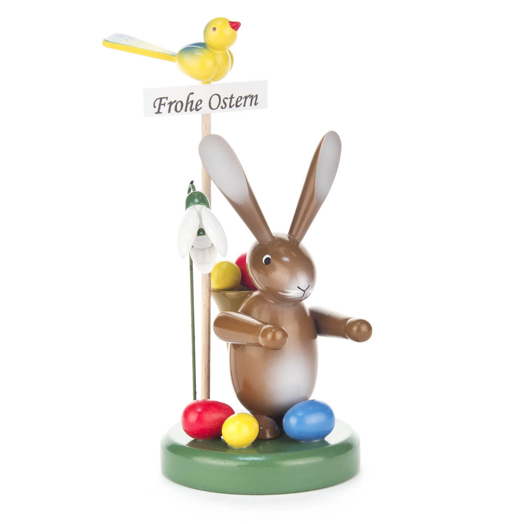 Holzhase mit Ostereiern, einer Blume und einem Vogel, der ein 'Frohe Ostern'-Schild hält. im Dregeno Online Shop günstig kaufen