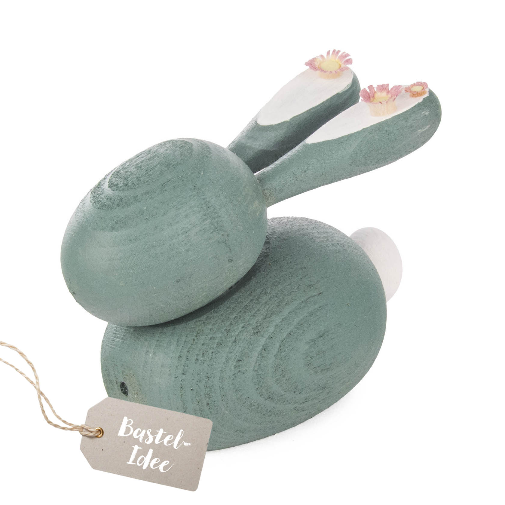 Holzhase Bastelset bemalt in Grün- und Weißtönen, mit Blumen auf den Ohren, 9 cm groß. im Dregeno Online Shop günstig kaufen