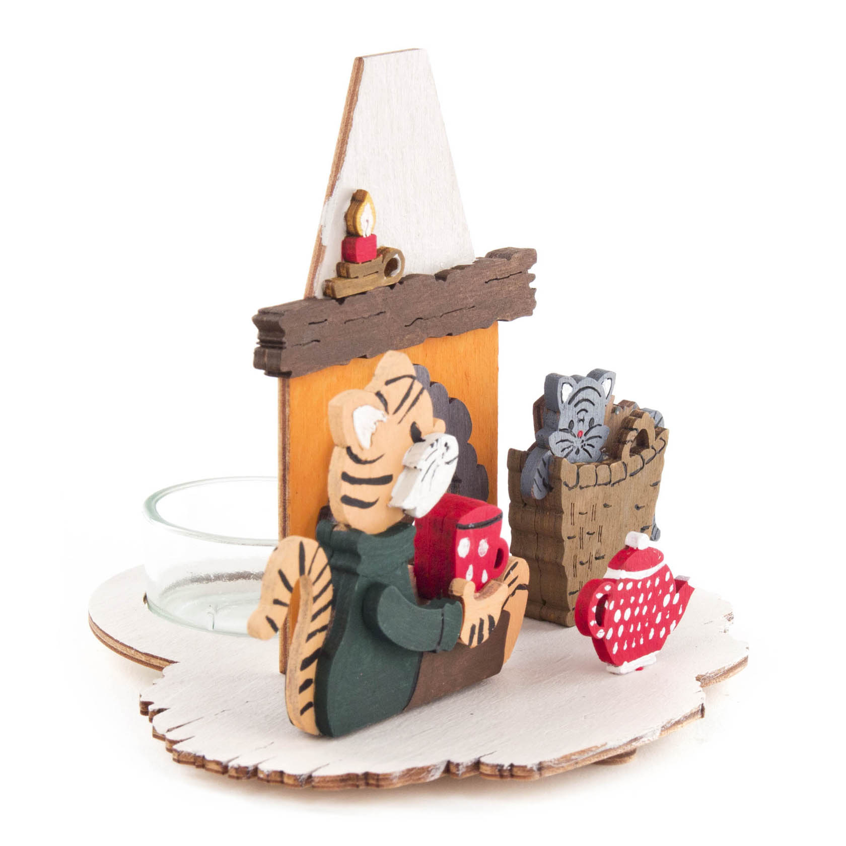 A handcrafted tealight holder set featuring a cat in a green scarf sitting by a wooden fireplace with a candle on the mantel, and a kitten in a basket.