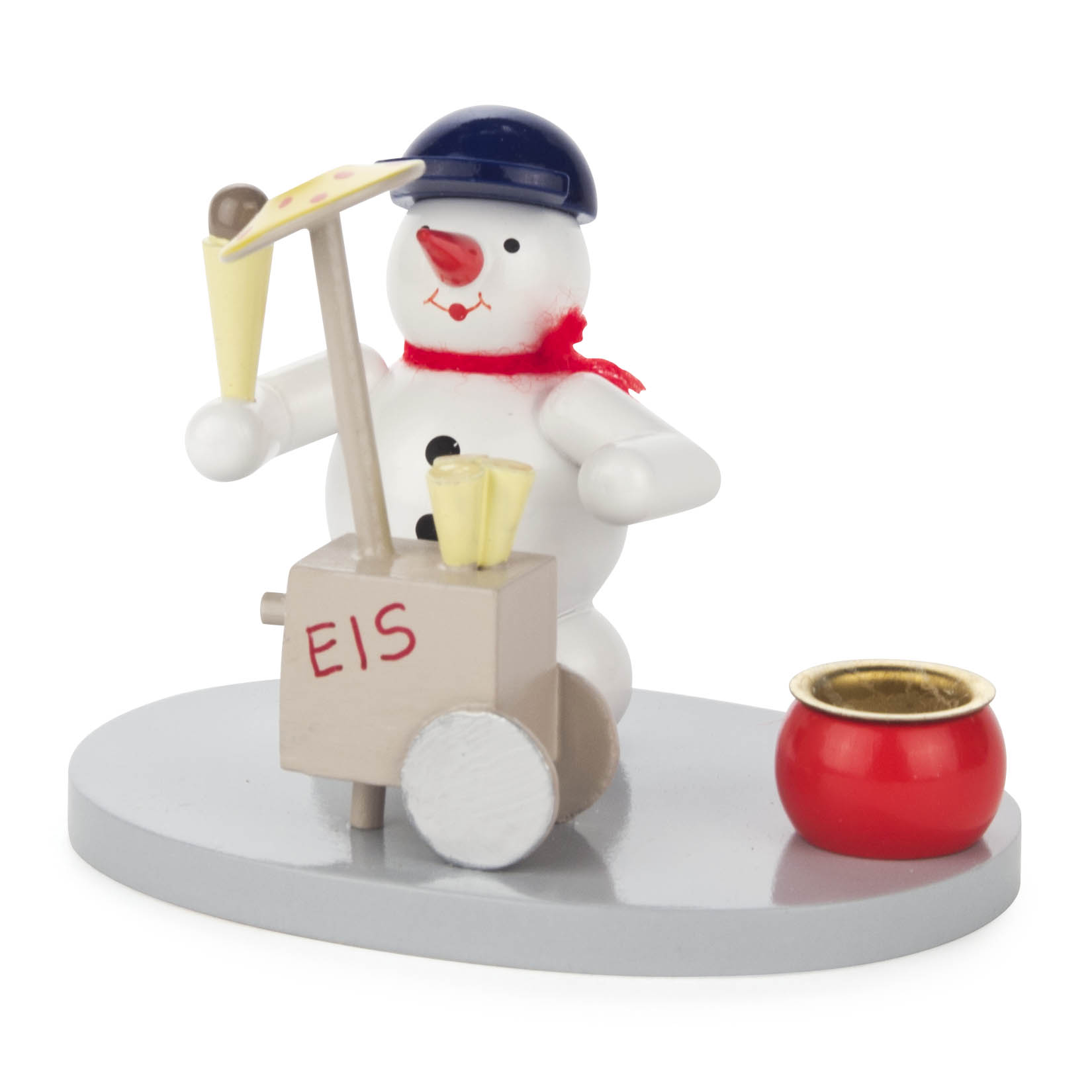 Ein Schneemann aus Holz mit blauer Mütze und rotem Schal verkauft Eis an einem mobilen Karren mit der Aufschrift 'EIS'. Er hält eine Eistüte in der Hand. im Dregeno Online Shop günstig kaufen