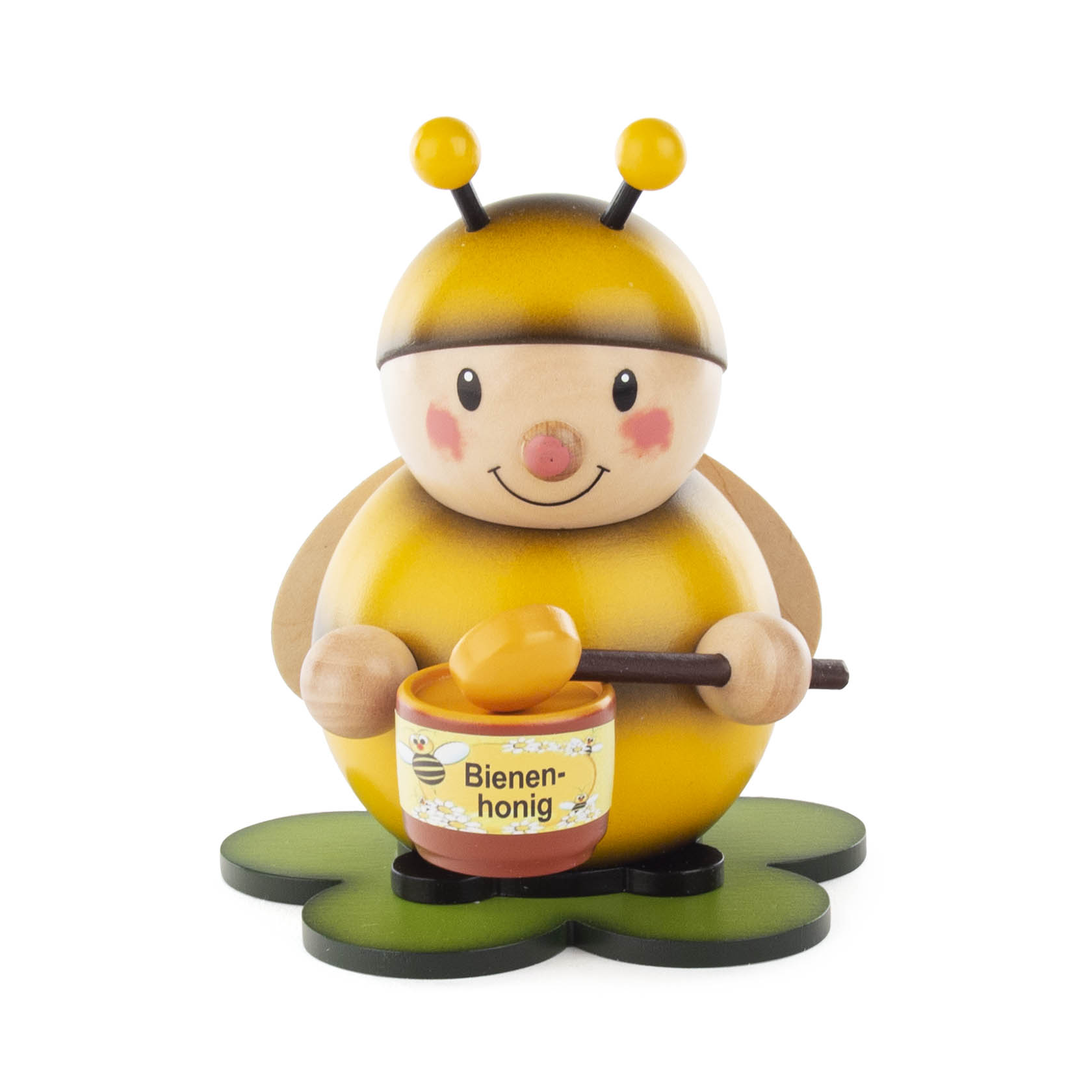 Holzfigur einer gelben Hummel mit roten Wangen, die einen Honigtopf und einen Löffel hält. Die Hummel steht auf einer grünen Blume. im Dregeno Online Shop günstig kaufen
