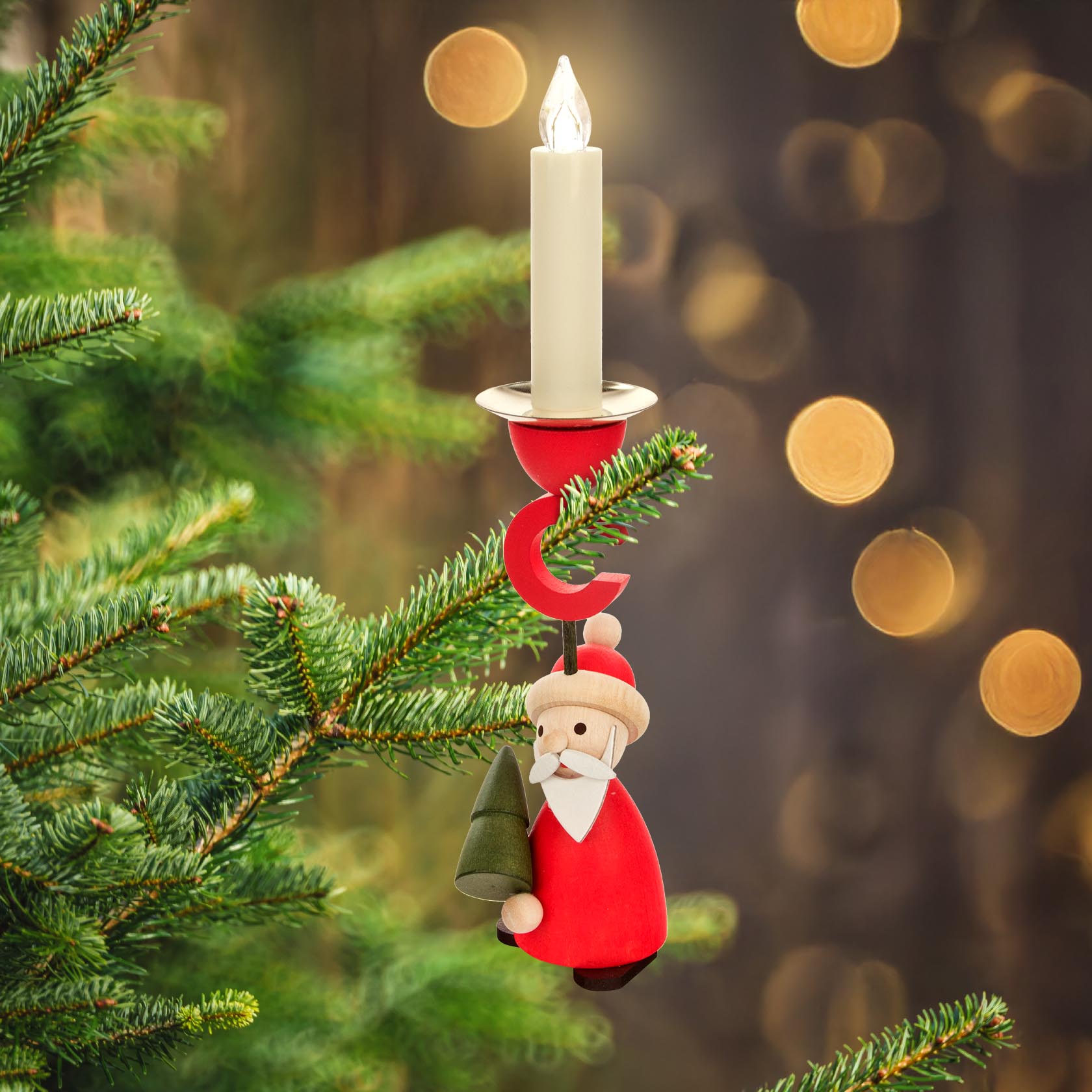 A wooden Santa Claus figurine candle holder attached to a Christmas tree branch, holding a 14mm candle.