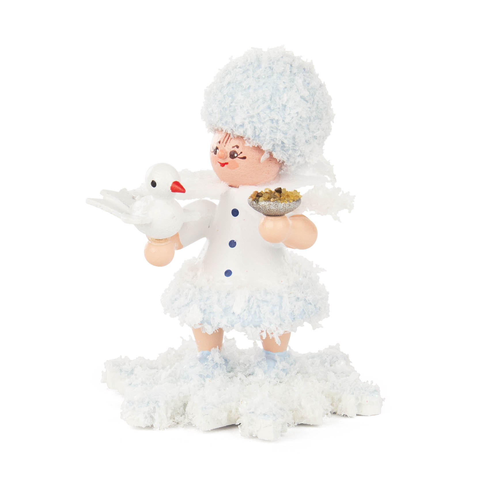 Eine stilisierte Figur eines Schneeflöckchens mit weißem Kleid und Mütze, ein weißer Vogel in der Hand, stehend auf künstlichem Schnee. im Dregeno Online Shop günstig kaufen