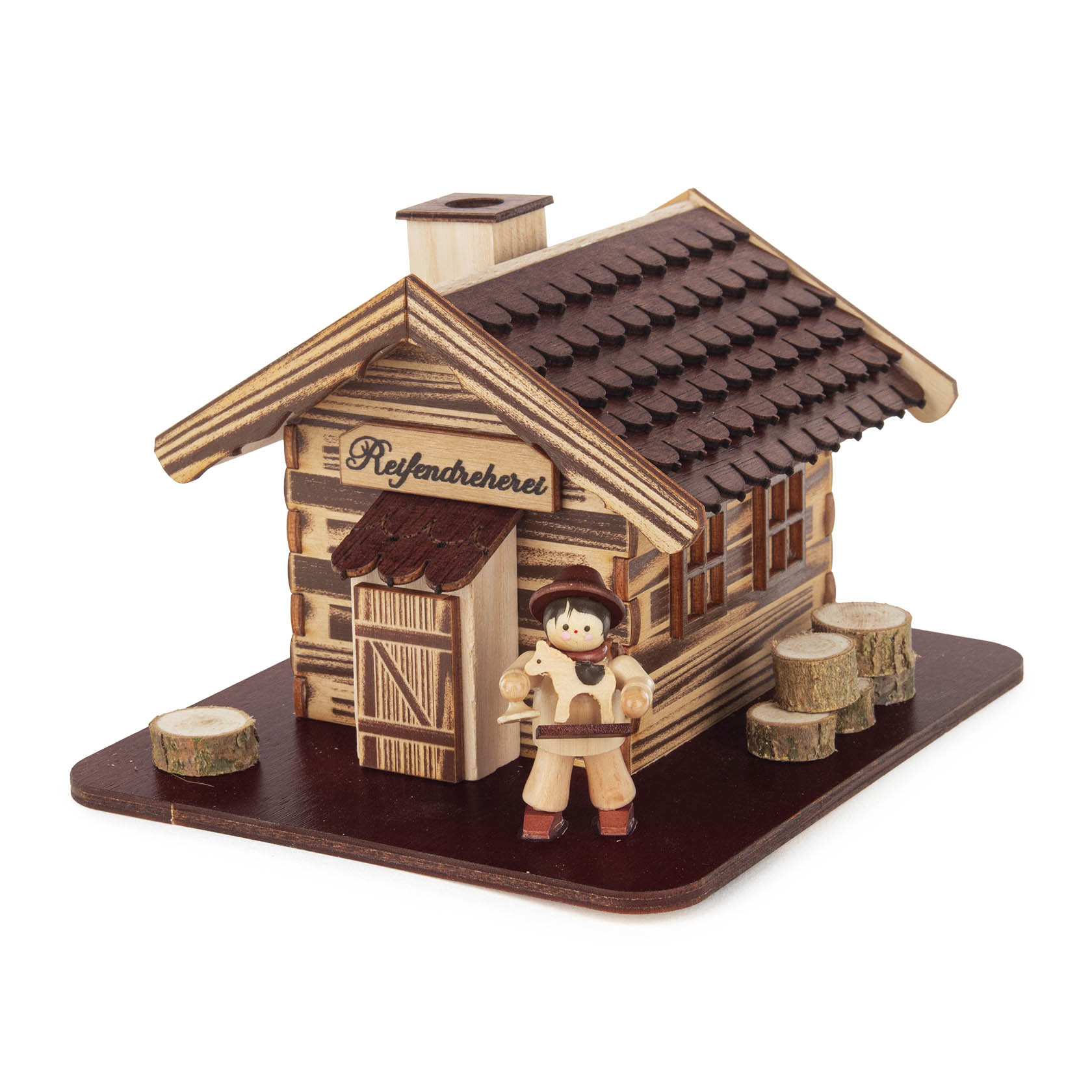 A wooden incense smoker shaped like a log cabin labeled 'Reifendreherei,' featuring a small figurine of a toy seller with toys in hand. im Dregeno Online Shop günstig kaufen