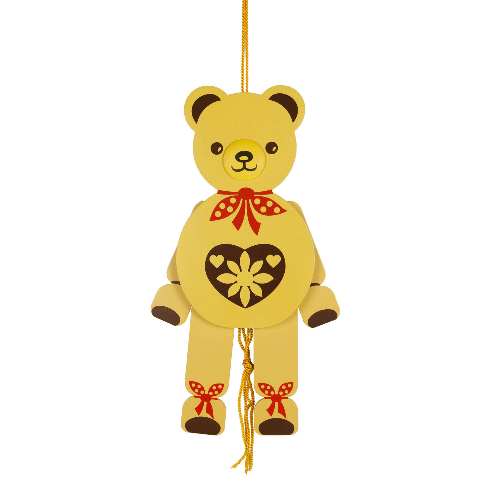 Ein gelber Hampelmann in Form eines Teddybären mit roten Punkten als Schleife und einem Herz mit Blume auf dem Bauch, hängend an einer Schnur. im Dregeno Online Shop günstig kaufen