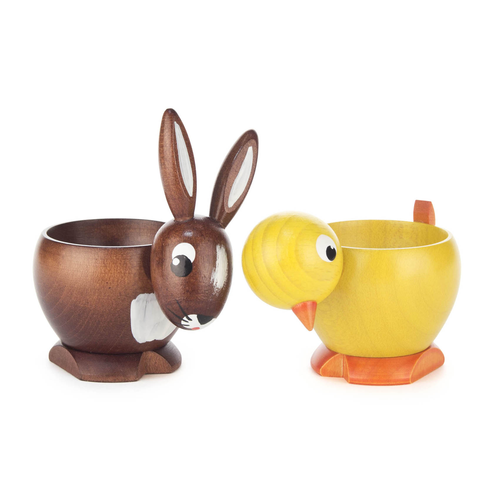 Zwei Eierbecher in Form eines braunen Hasen und eines gelben Kükens, beide mit niedlichen Augen und Details versehen. im Dregeno Online Shop günstig kaufen
