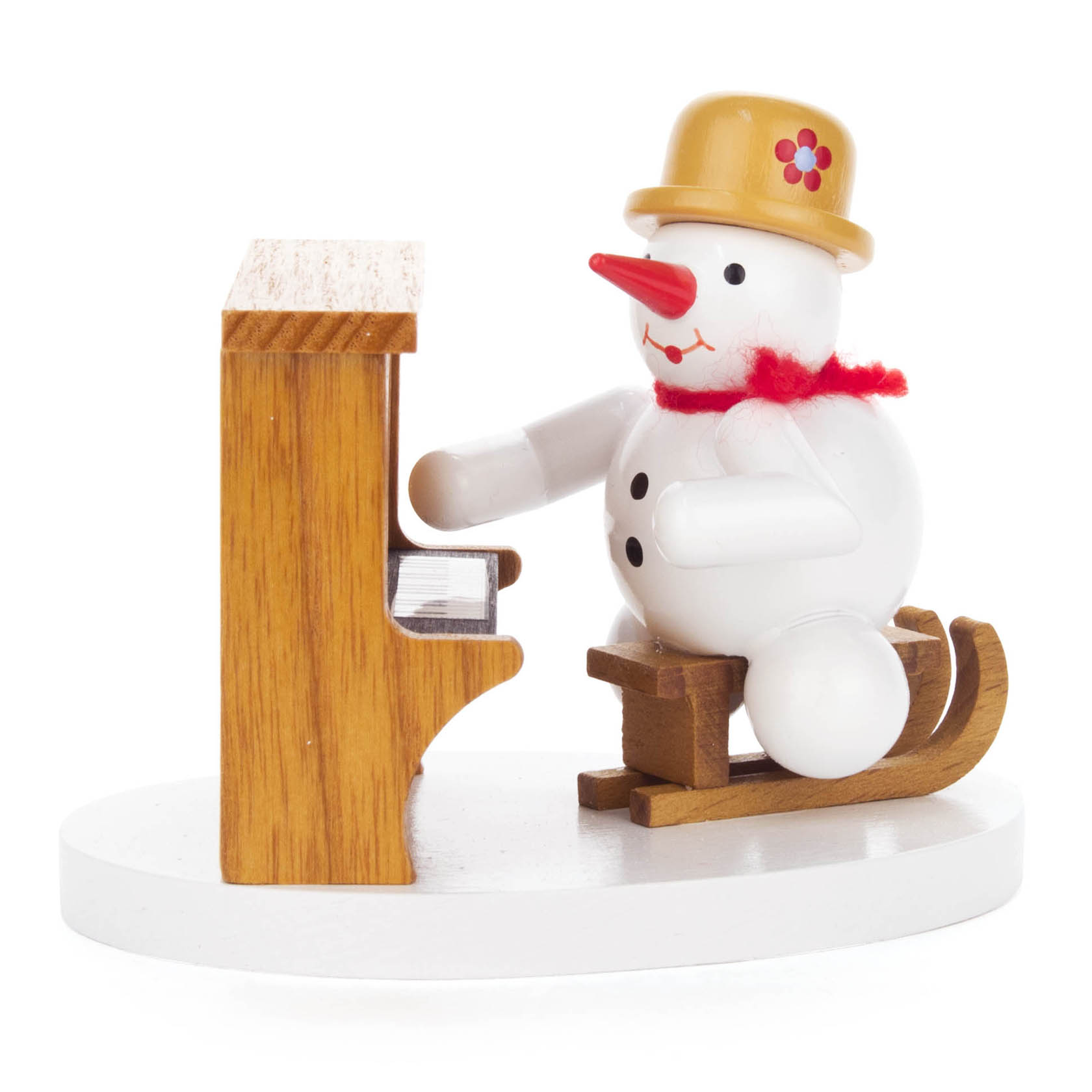 Holzfigur eines Schneemanns mit roten Schal und beigem Hut, der an einem kleinen braunen Klavier sitzt. im Dregeno Online Shop günstig kaufen