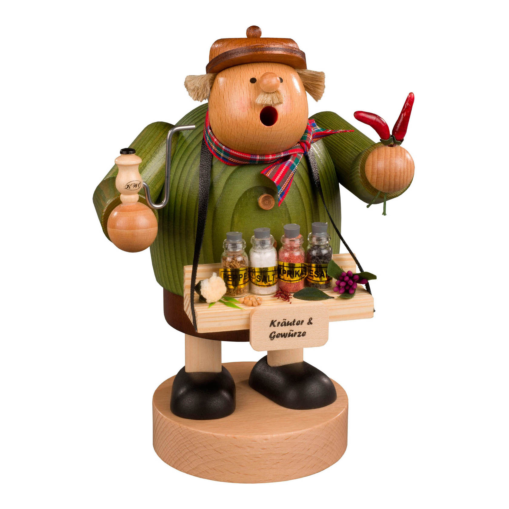 Ein Räuchermann in Form eines Gewürzhändlers mit grünem Mantel und braunem Hut, hält Chilischoten in der einen Hand, eine Gewürzflasche in der anderen und steht auf einem Holzsockel. im Dregeno Online Shop günstig kaufen