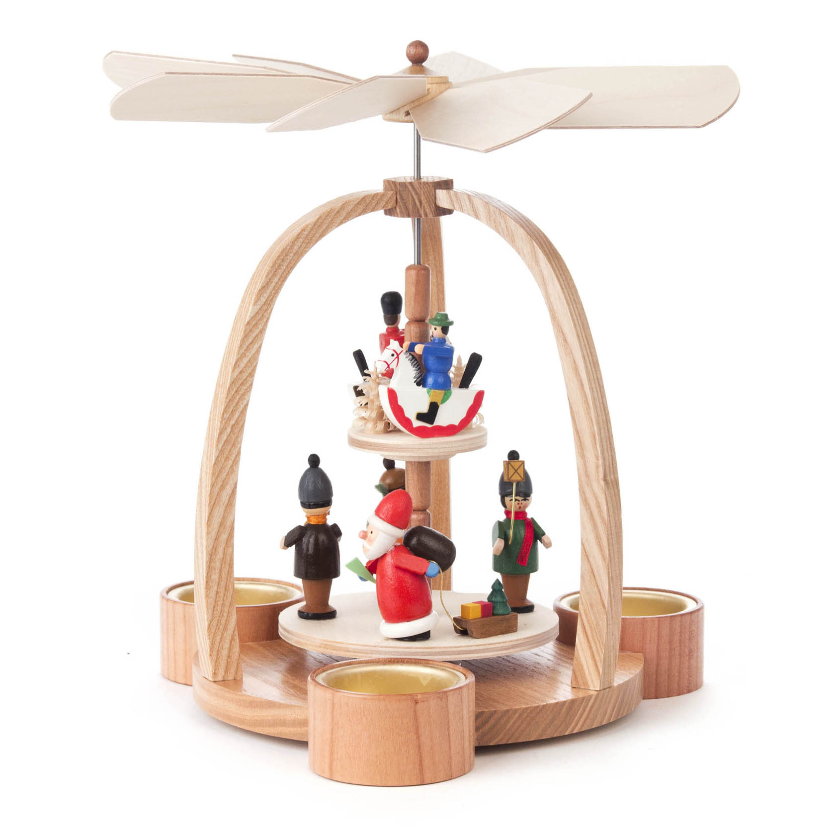 Zweistöckige Weihnachtspyramide aus Holz mit Weihnachtsmann, zwei Nussknackerfiguren und Reiterlein, betrieben durch Teelichtwärme.