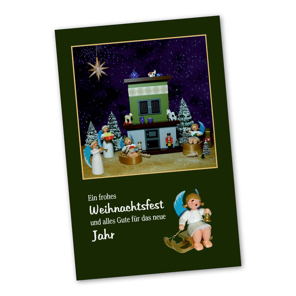 Christmas card showing a nativity scene with angels, a building resembling a stable, a star above, and a message in German wishing a Merry Christmas. im Dregeno Online Shop günstig kaufen