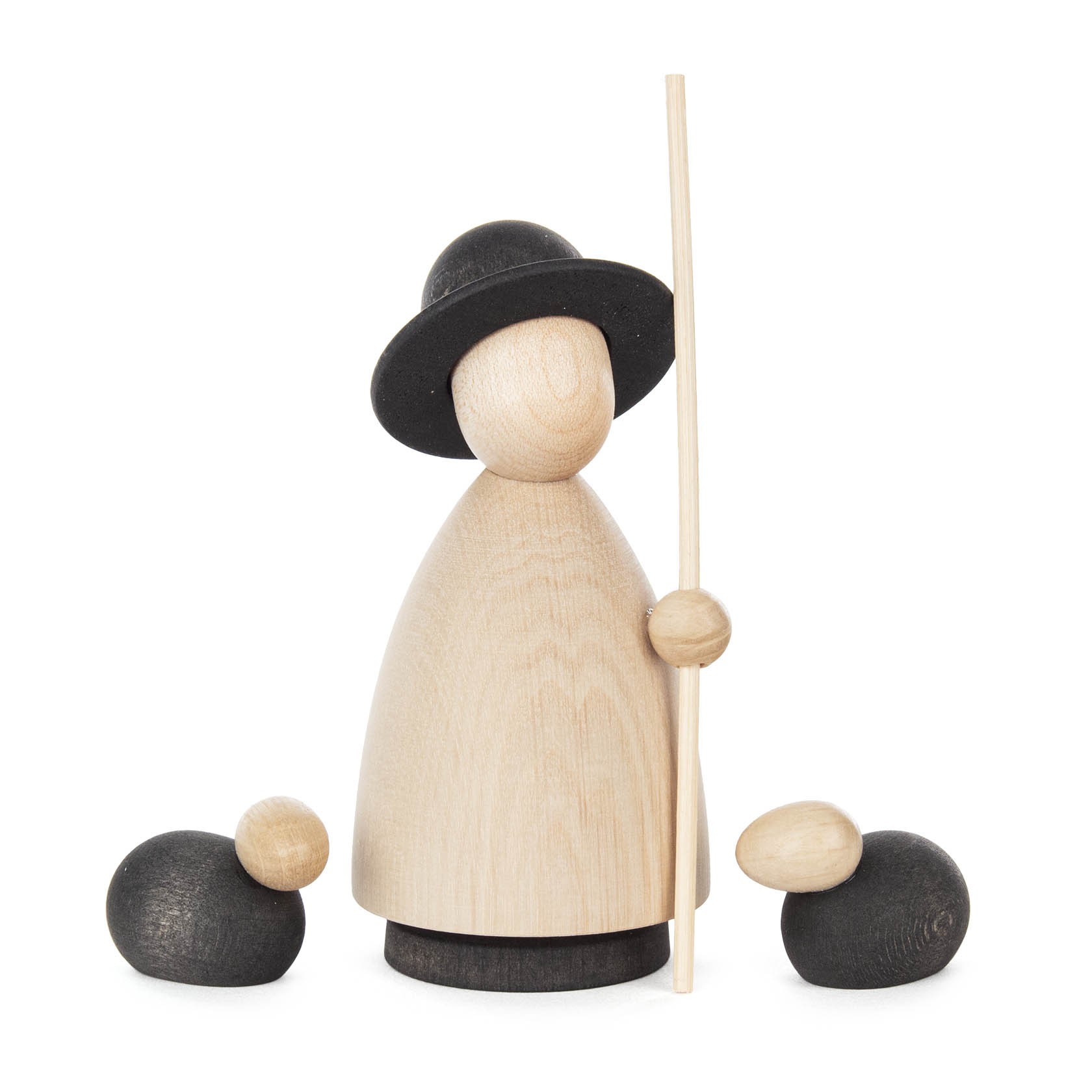 Holzfigur eines Schäfers mit schwarzem Hut und Stab, flankiert von zwei schwarzen Holzschafen. im Dregeno Online Shop günstig kaufen