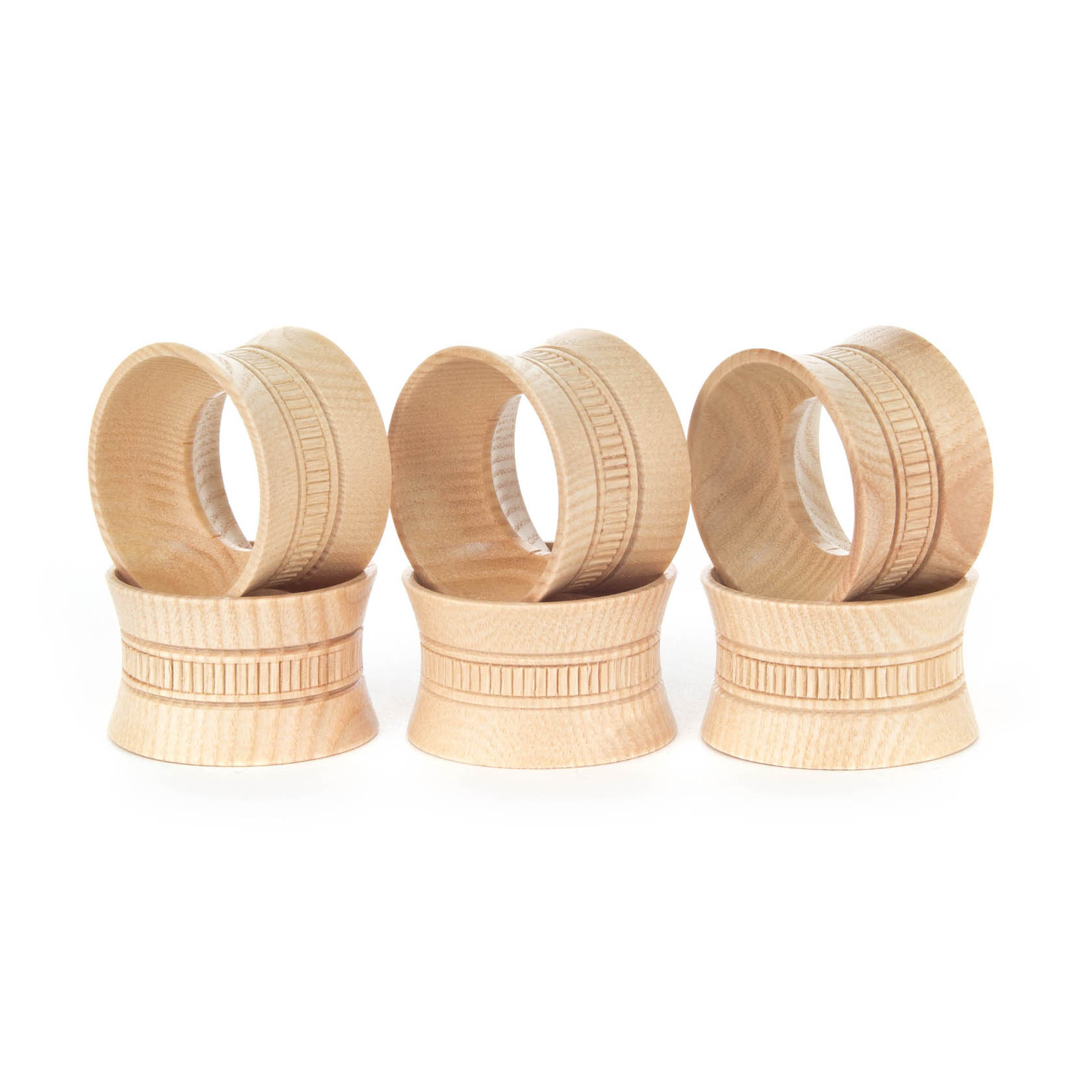 Set of six wooden items, dual-purpose as egg cups or napkin rings, featuring a simple design with carved lines. im Dregeno Online Shop günstig kaufen