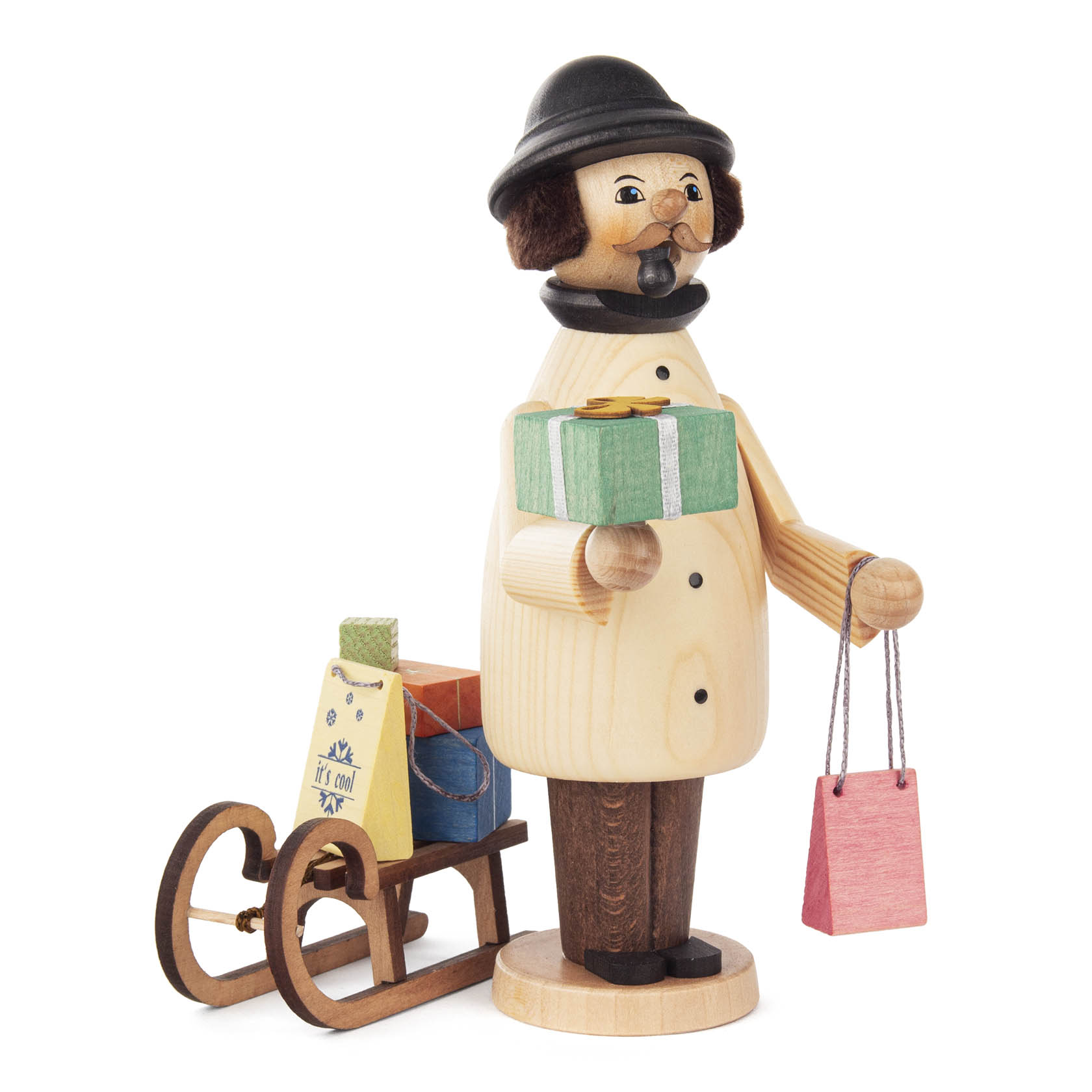 Wooden incense smoker figure of a man with a black hat holding a gift and red shopping bag, standing next to a sled with presents. im Dregeno Online Shop günstig kaufen