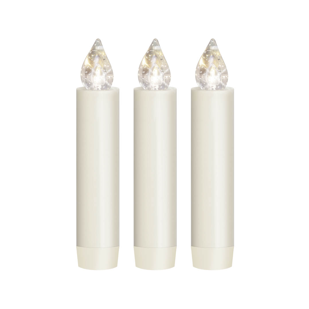 Three creamy white candle-shaped LED lights with clear and faceted tops to mimic candle flames, standing upright.