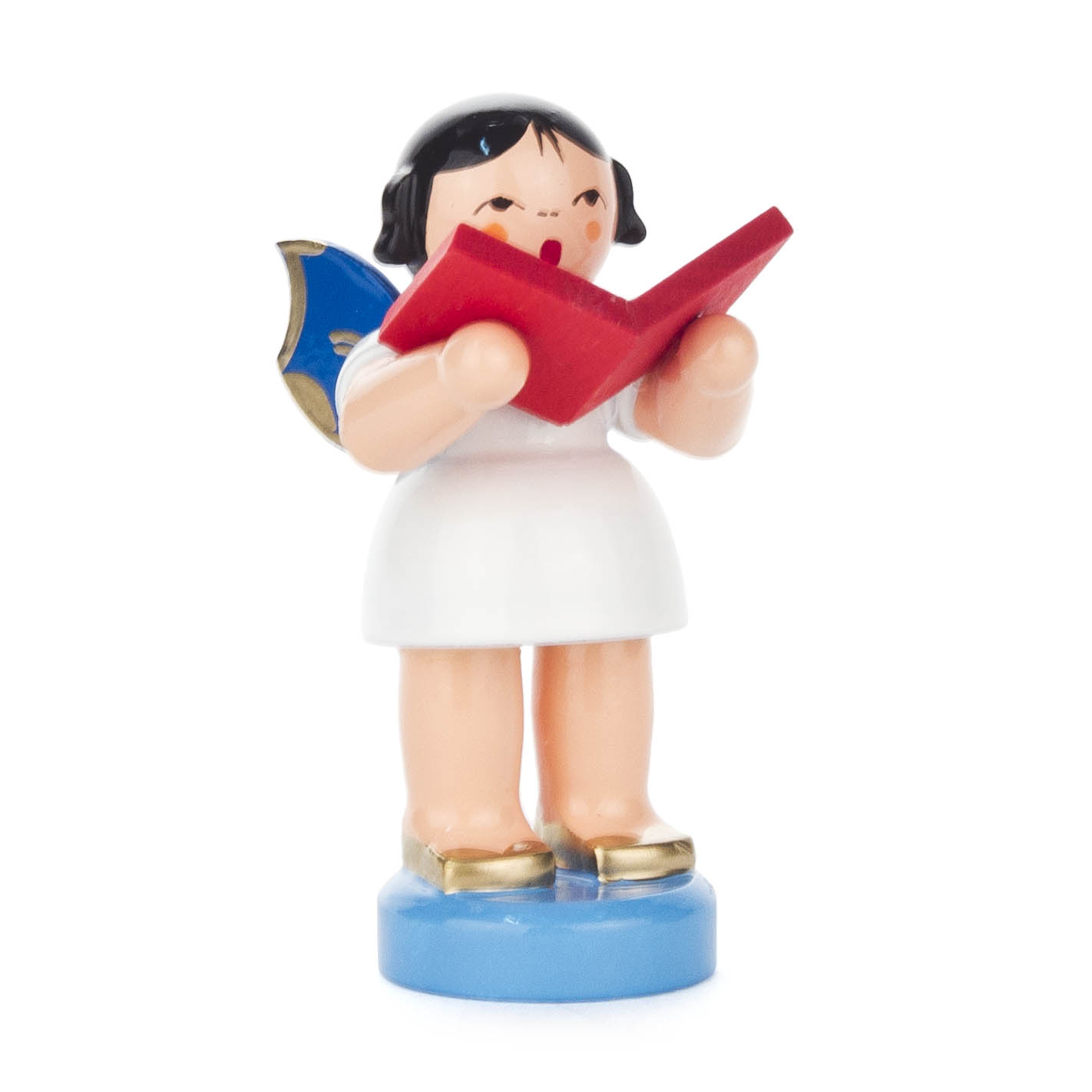 Figur eines Engels mit schwarzen Haaren, weißem Kleid und goldenen Schuhen. Der Engel hält ein rotes Buch und hat blaue Flügel. im Dregeno Online Shop günstig kaufen