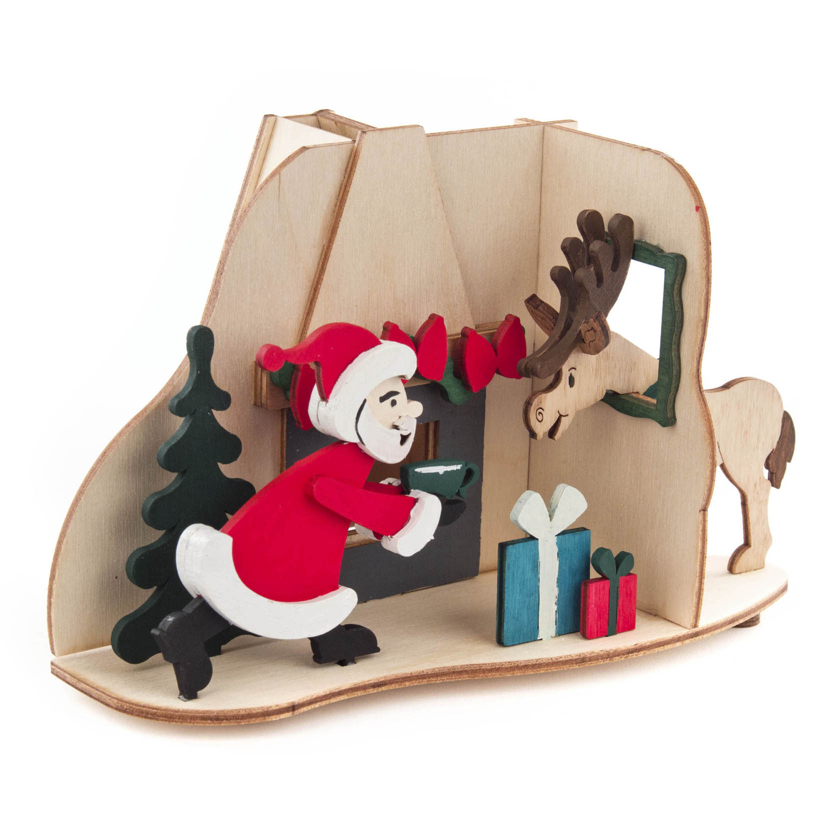 Wooden crafting set featuring Santa Claus placing logs in a fireplace with a moose peeking through a window and three gift boxes on the floor.