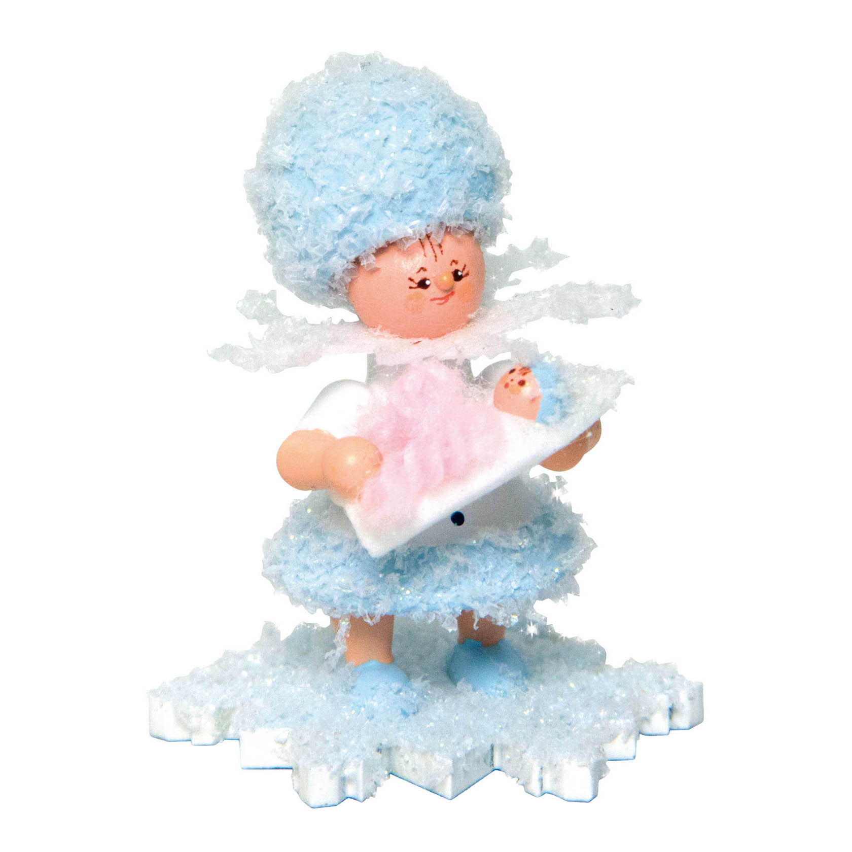 A figurine of a girl dressed in textured blue and white snowflake-themed clothing, holding a small baby wrapped in a pink and blue blanket. im Dregeno Online Shop günstig kaufen