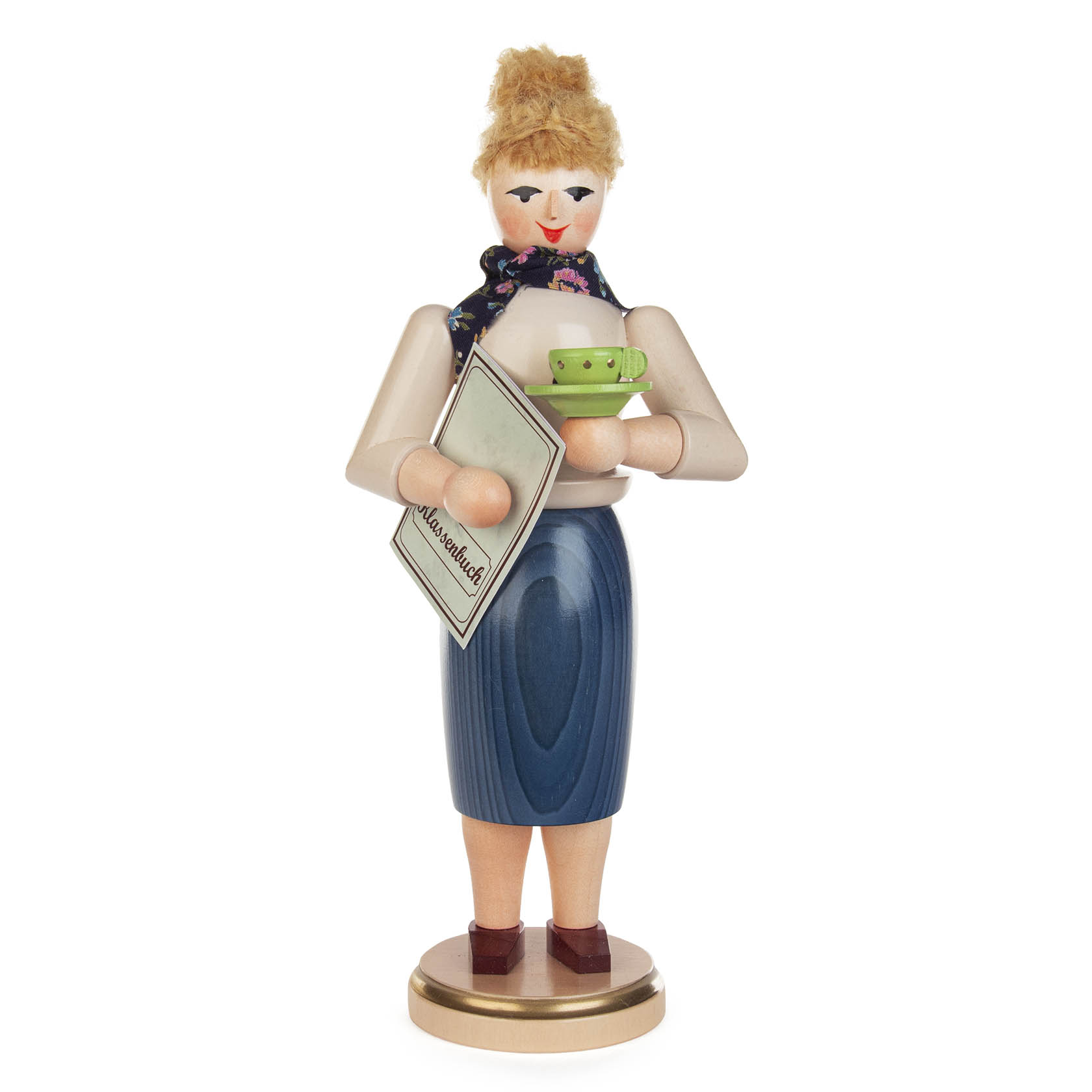 Räucherfigur einer Lehrerin mit blonden Haaren, weißem Oberteil, schwarzem Rock und einem Schal. Sie hält ein rotes Teeset und ein Buch mit der Aufschrift 'Alte Schrift'. im Dregeno Online Shop günstig kaufen