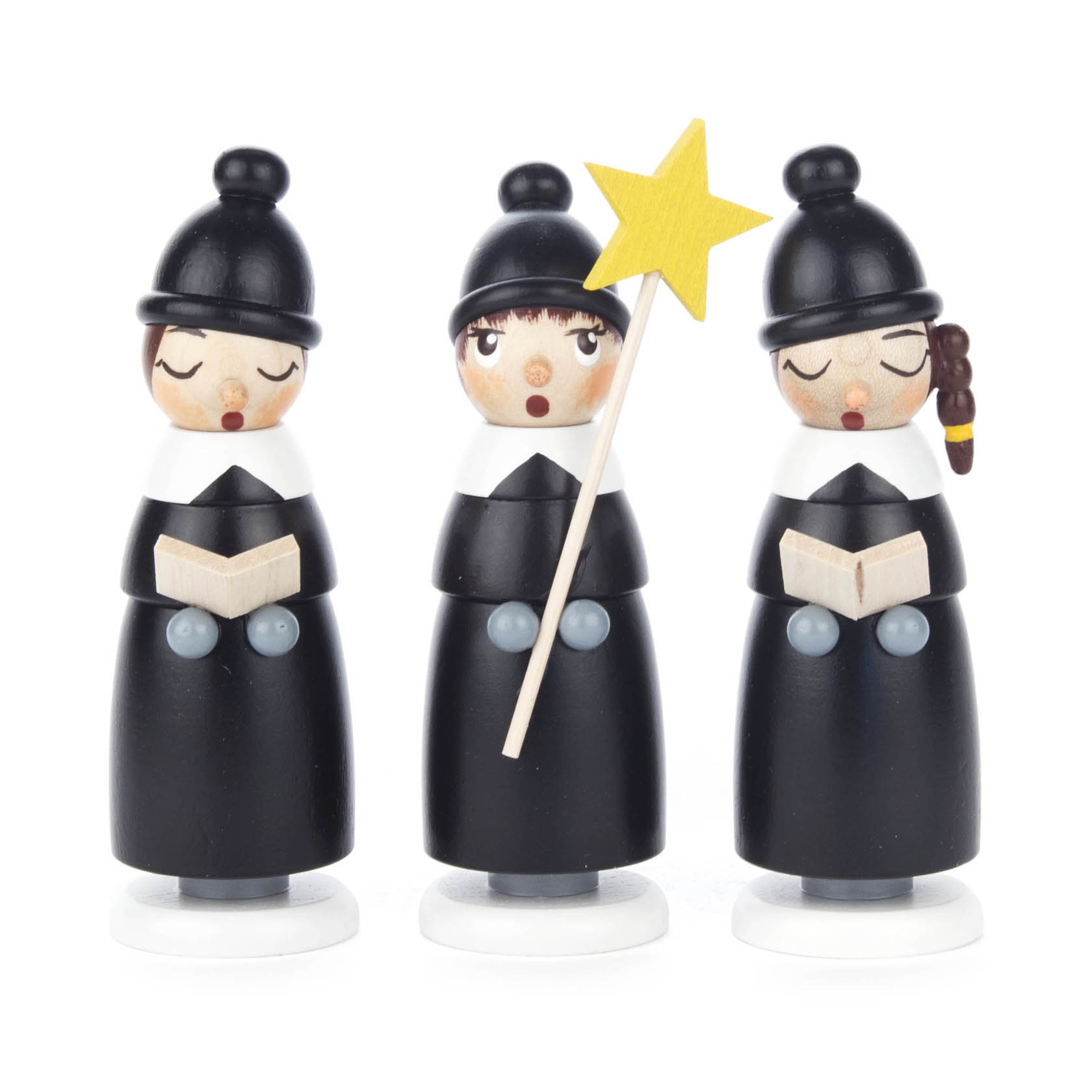 Drei schwarze Kurrendefiguren mit geschlossenen Augen, die jeweils ein Buch halten. Eine Figur hält zusätzlich einen gelben Stern.